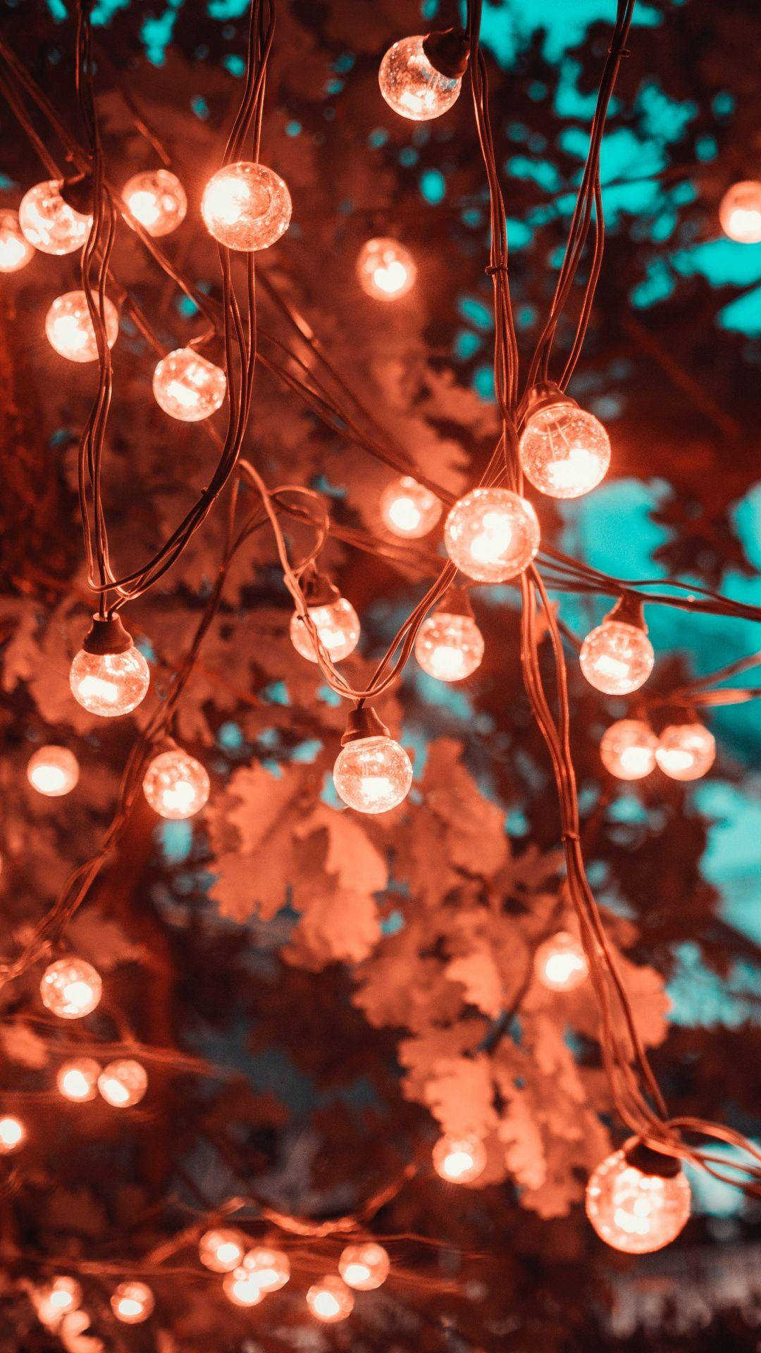 Christmas lights, string lights, teal sky, Full HD Phone Wallpaper