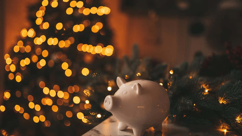 white ceramic piggy bank, evergreen branches, warm golden bokeh lights, SD Desktop Wallpaper