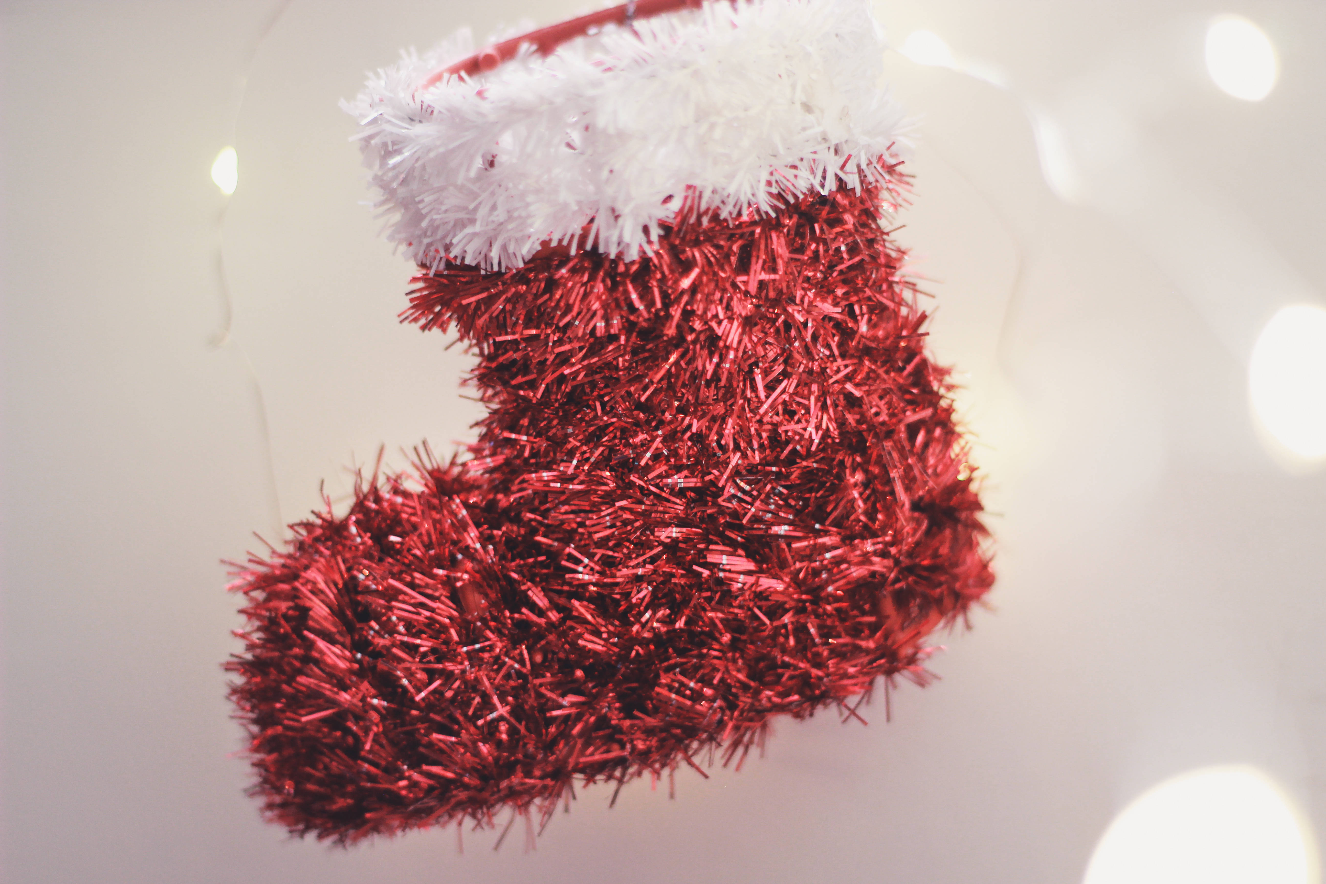 Aesthetic Red Christmas Sock, red tinsel Christmas stocking, white fluffy trim, 5K Desktop Wallpaper