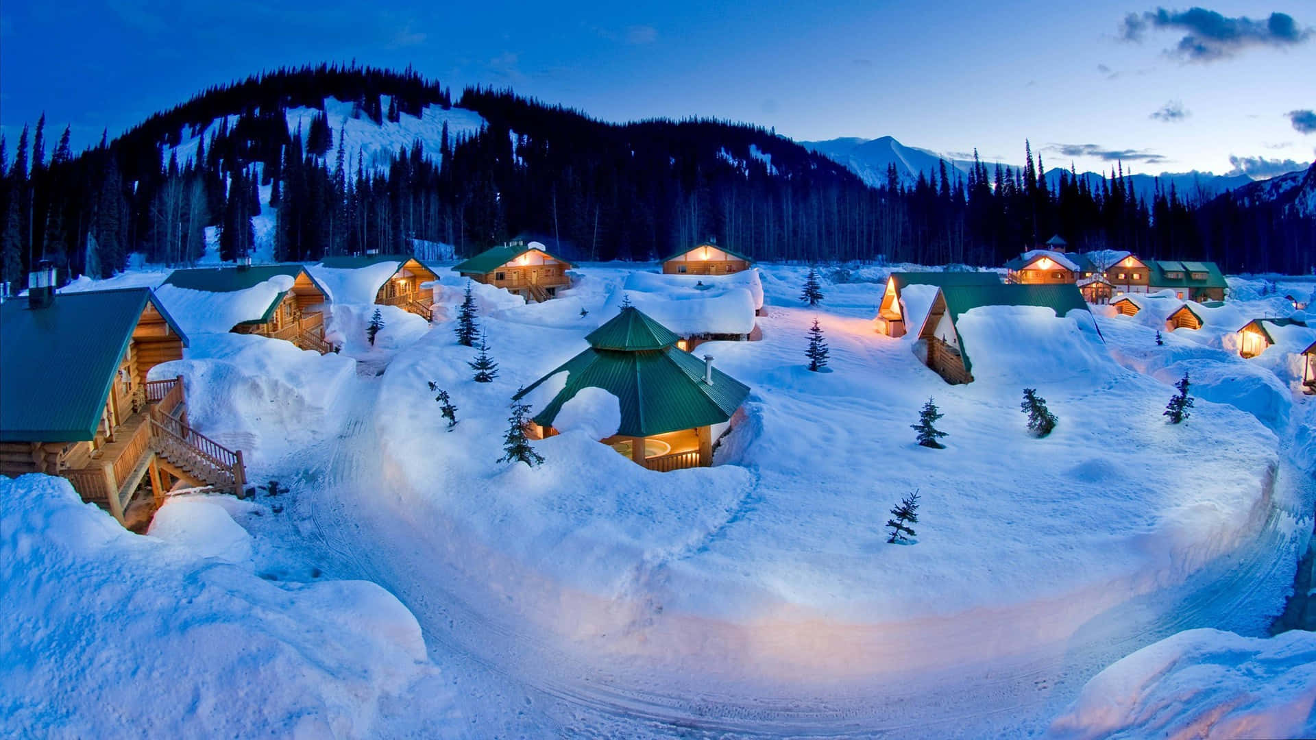 Christmas Winter Wonderland, snow-covered cabins, twilight mountain backdrop, Full HD Desktop Wallpaper
