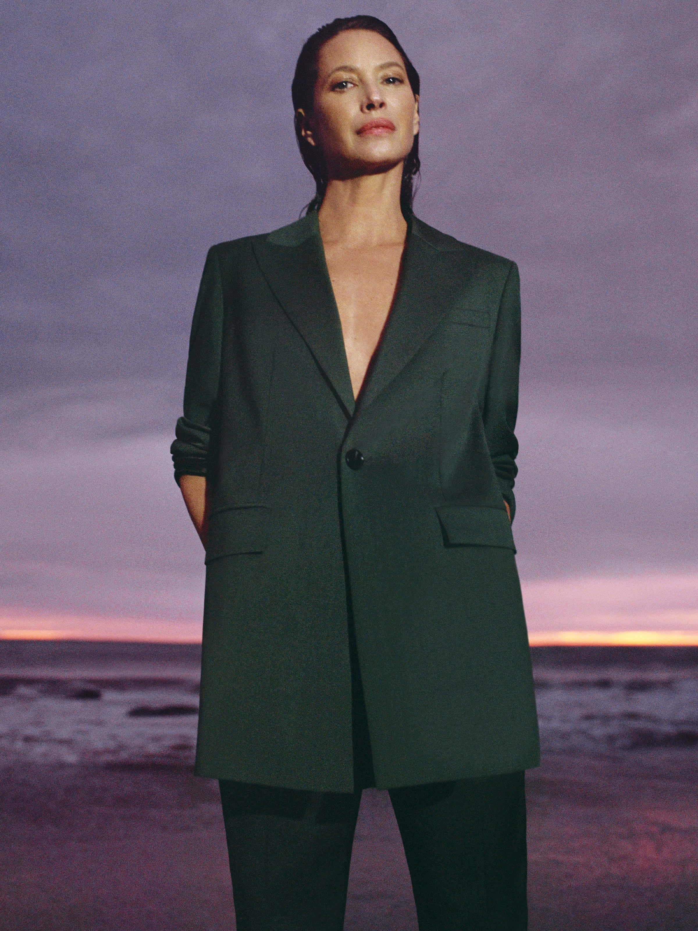 Christy Turlington, dark green blazer, beach at twilight, 2K Phone Wallpaper