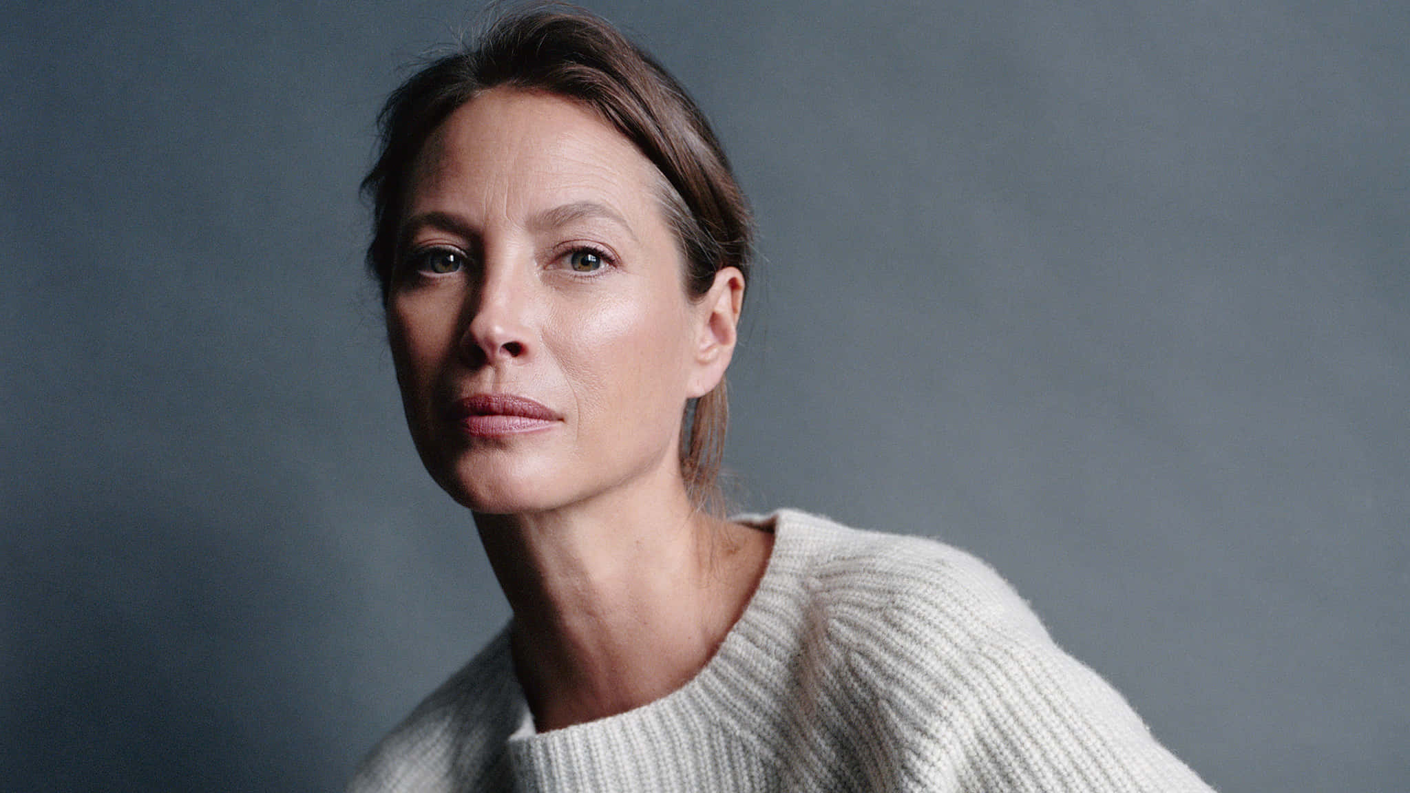 Christy Turlington, cream sweater, muted gray studio backdrop, Full HD Desktop Wallpaper