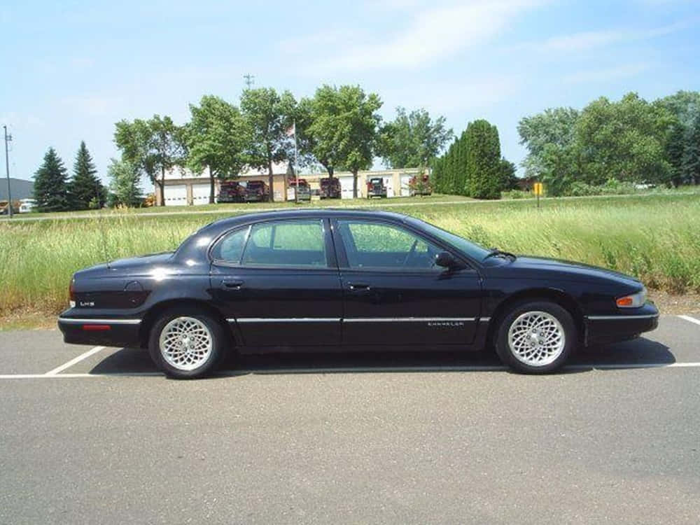 Chrysler LHS, sleek black, sunny lot, SD Desktop Wallpaper