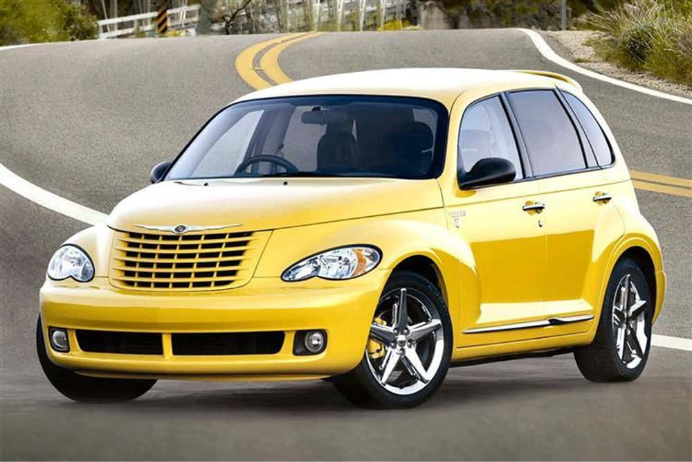 Chrysler PT Cruiser, bright yellow, winding asphalt road, SD Desktop Wallpaper