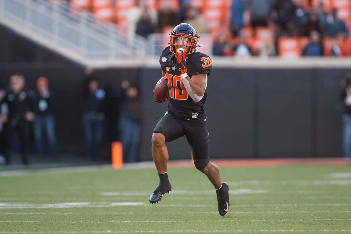 Chuba Hubbard, black and orange gear, football player, SD Desktop Wallpaper