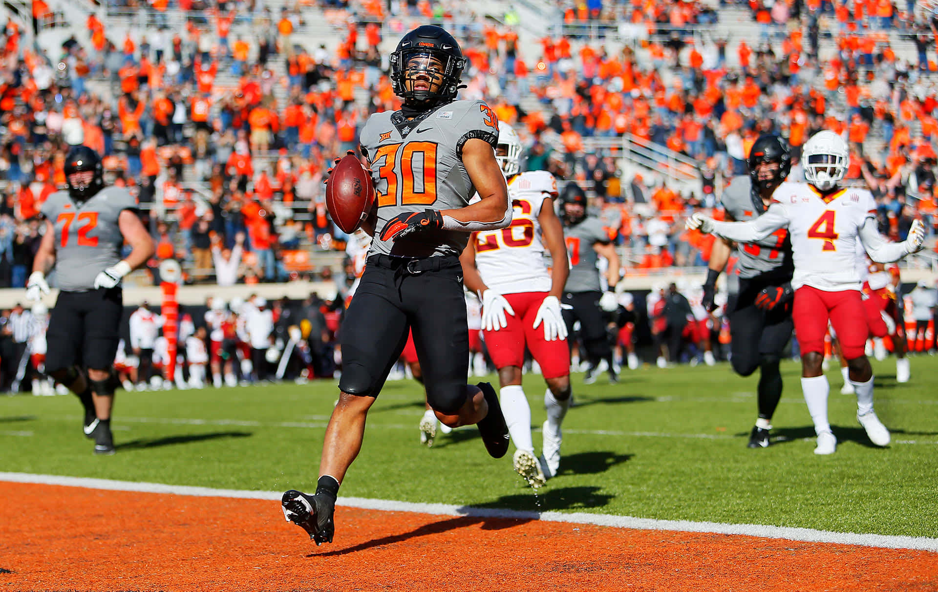 Chuba Hubbard, gray jersey number 30, sprints with the ball down the sideline, Full HD Desktop Wallpaper