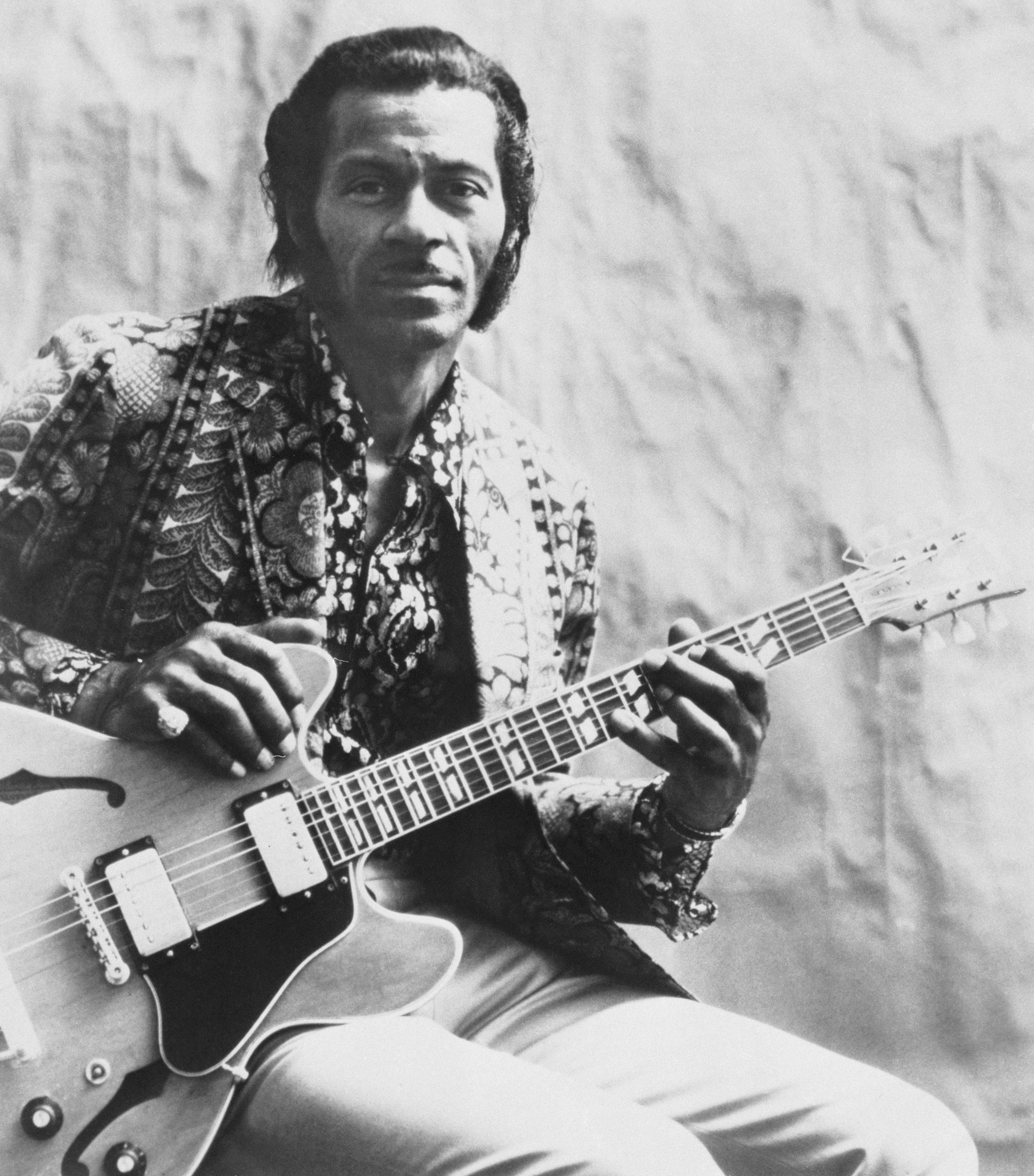 Chuck Berry, electric guitar, textured backdrop, 2K Phone Wallpaper