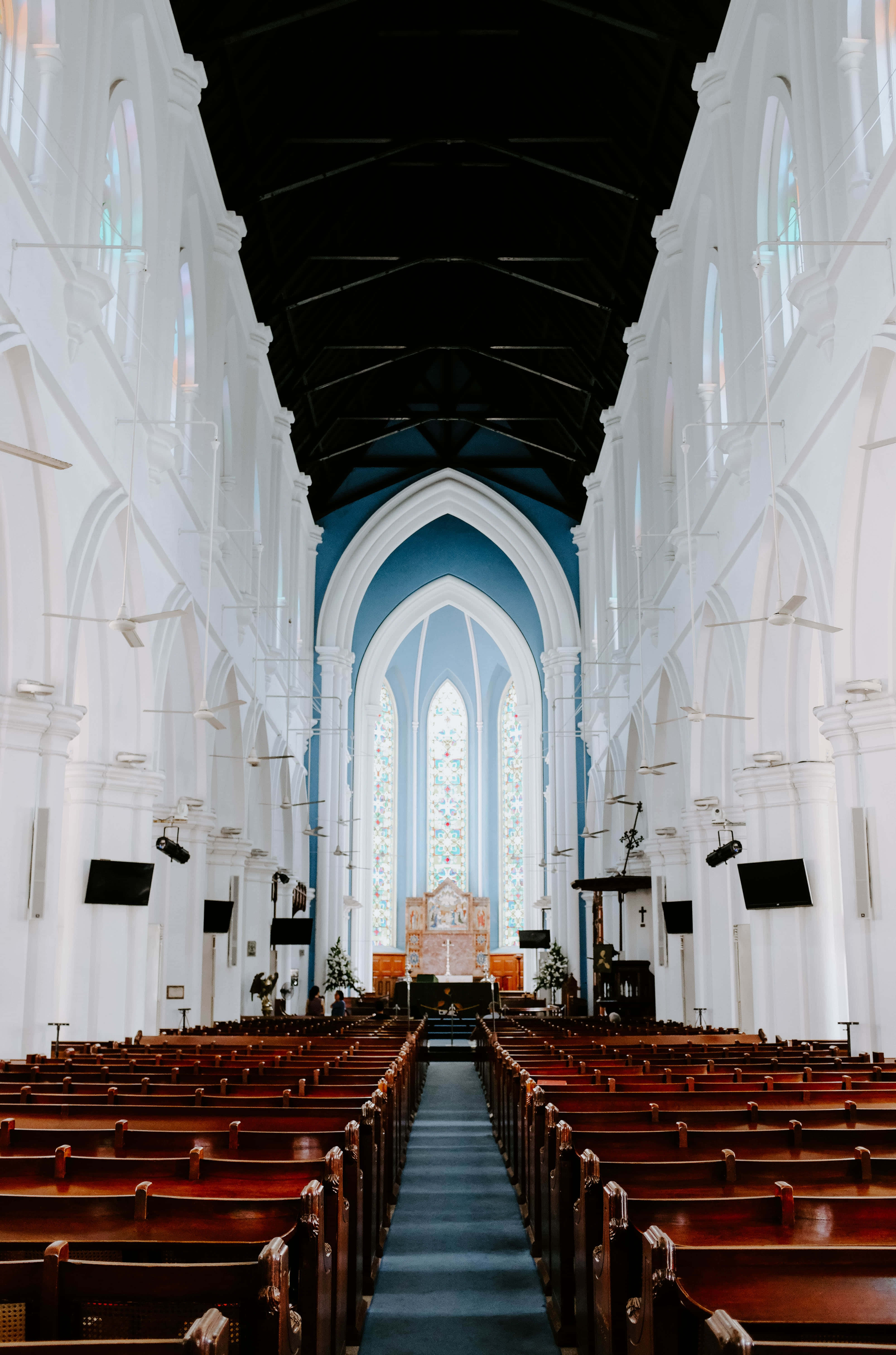 white cathedral, wooden pews, blue arched stained glass window, 5K Phone Wallpaper