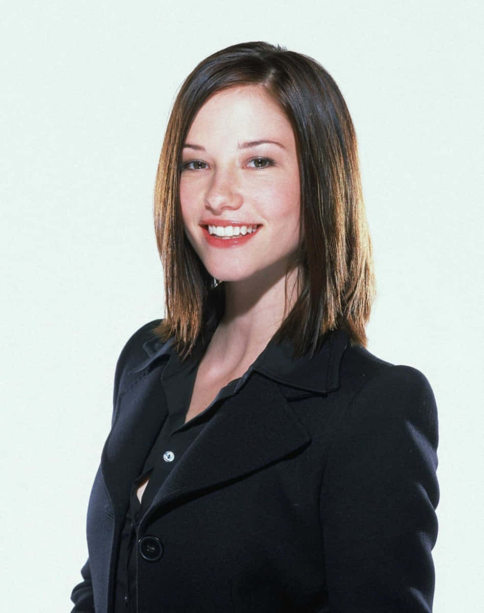 Chyler Leigh, black blazer, shoulder-length brown hair, SD Phone Wallpaper