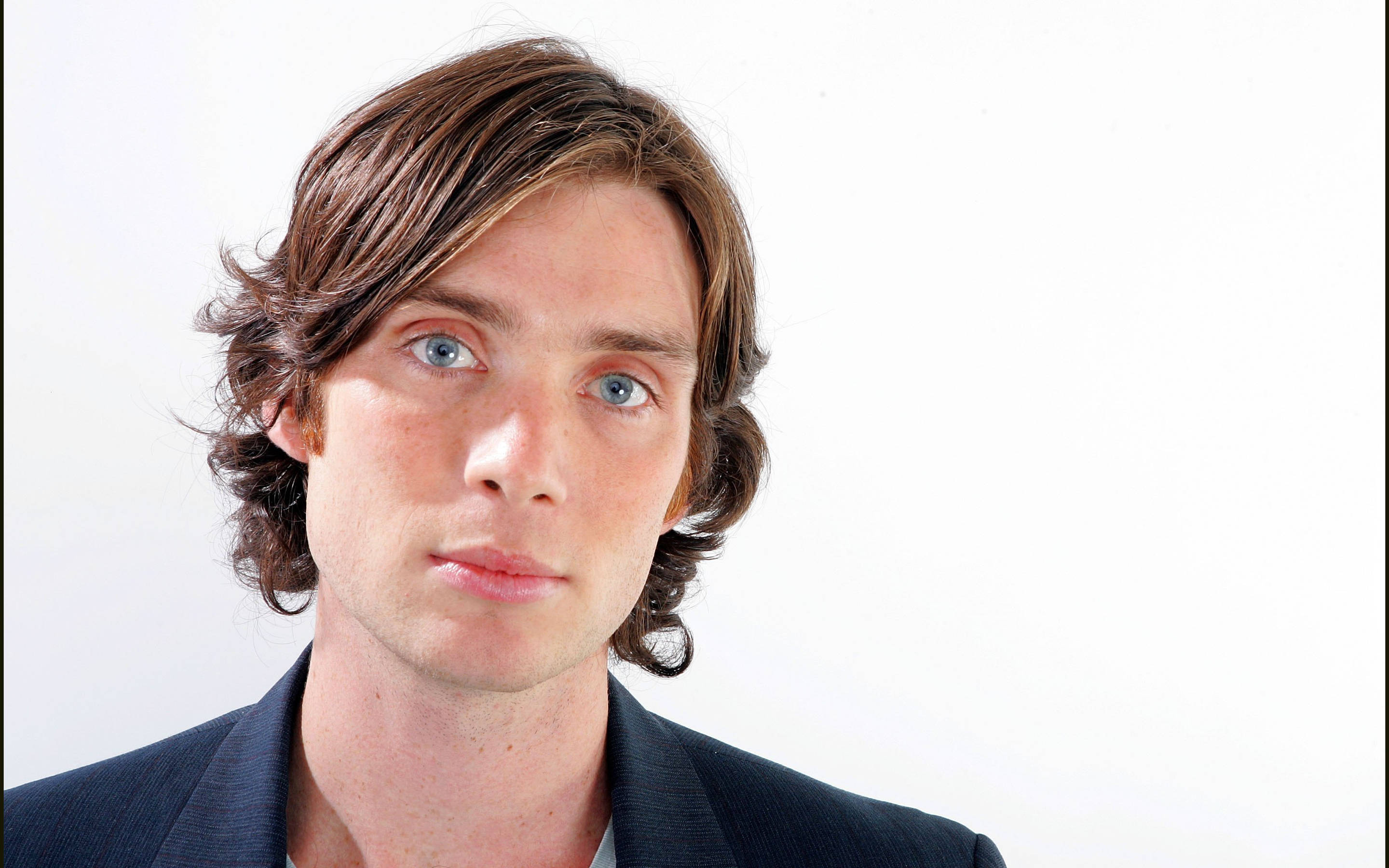 Cillian Murphy, wavy brown hair, striking blue eyes, 2K Desktop Wallpaper