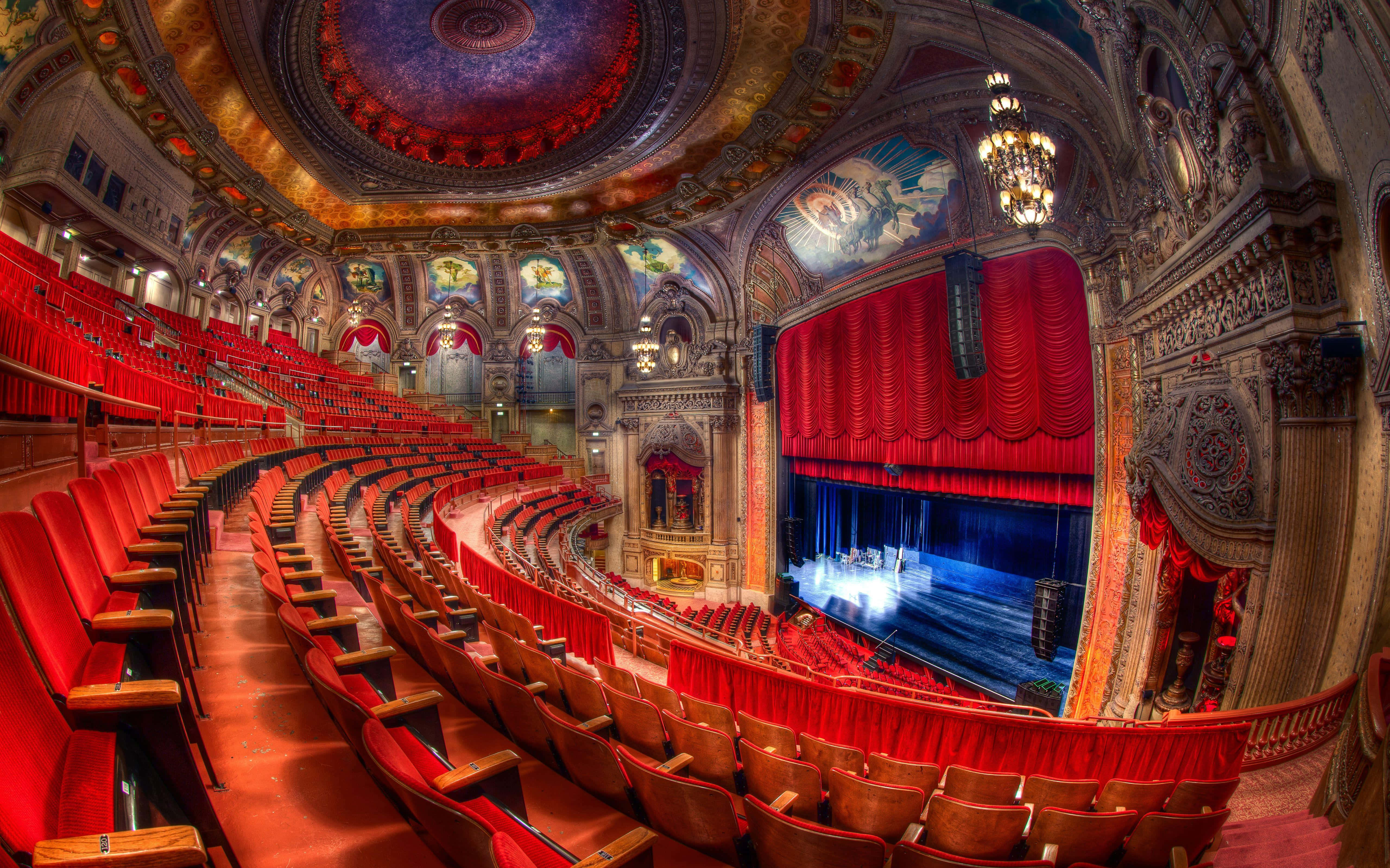 opulent theater interior, red velvet seats, ornate gold ceiling, 5K Desktop Wallpaper