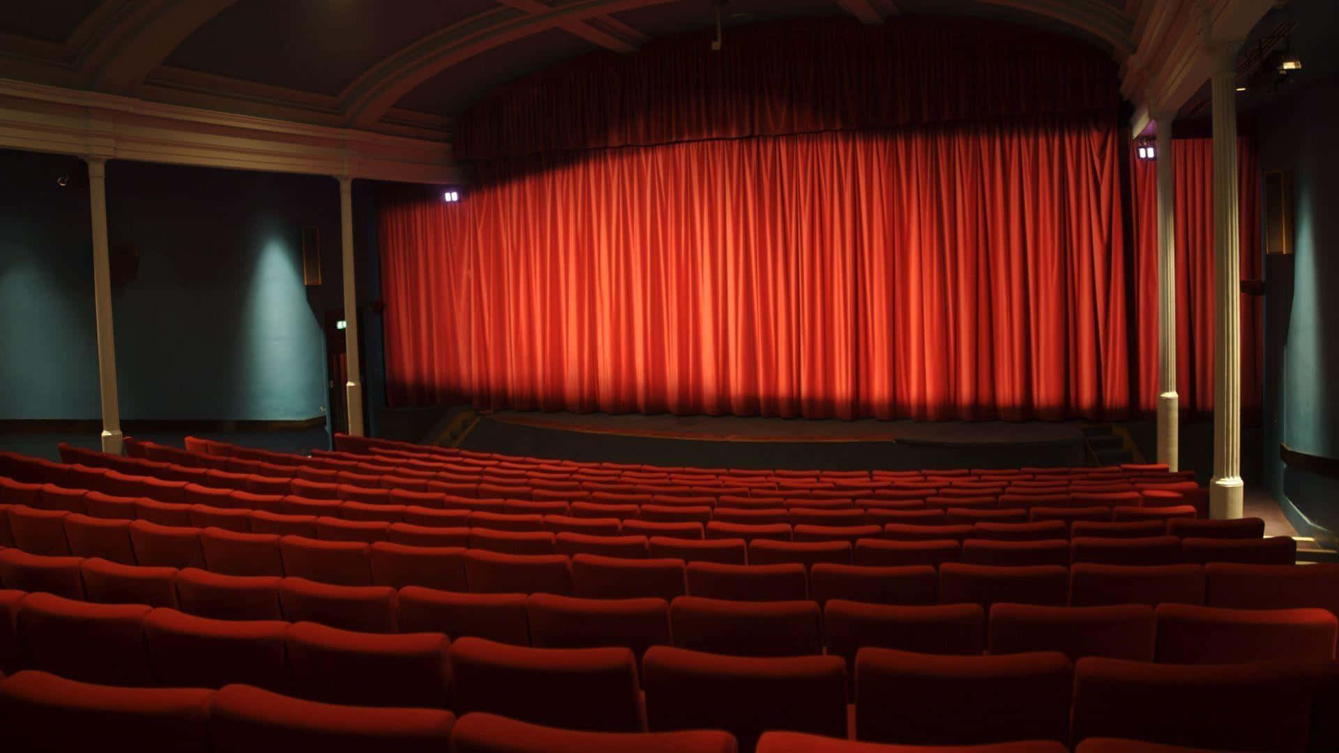 classic cinema interior, red velvet theater seats, grand illuminated red curtain, Full HD Desktop Wallpaper