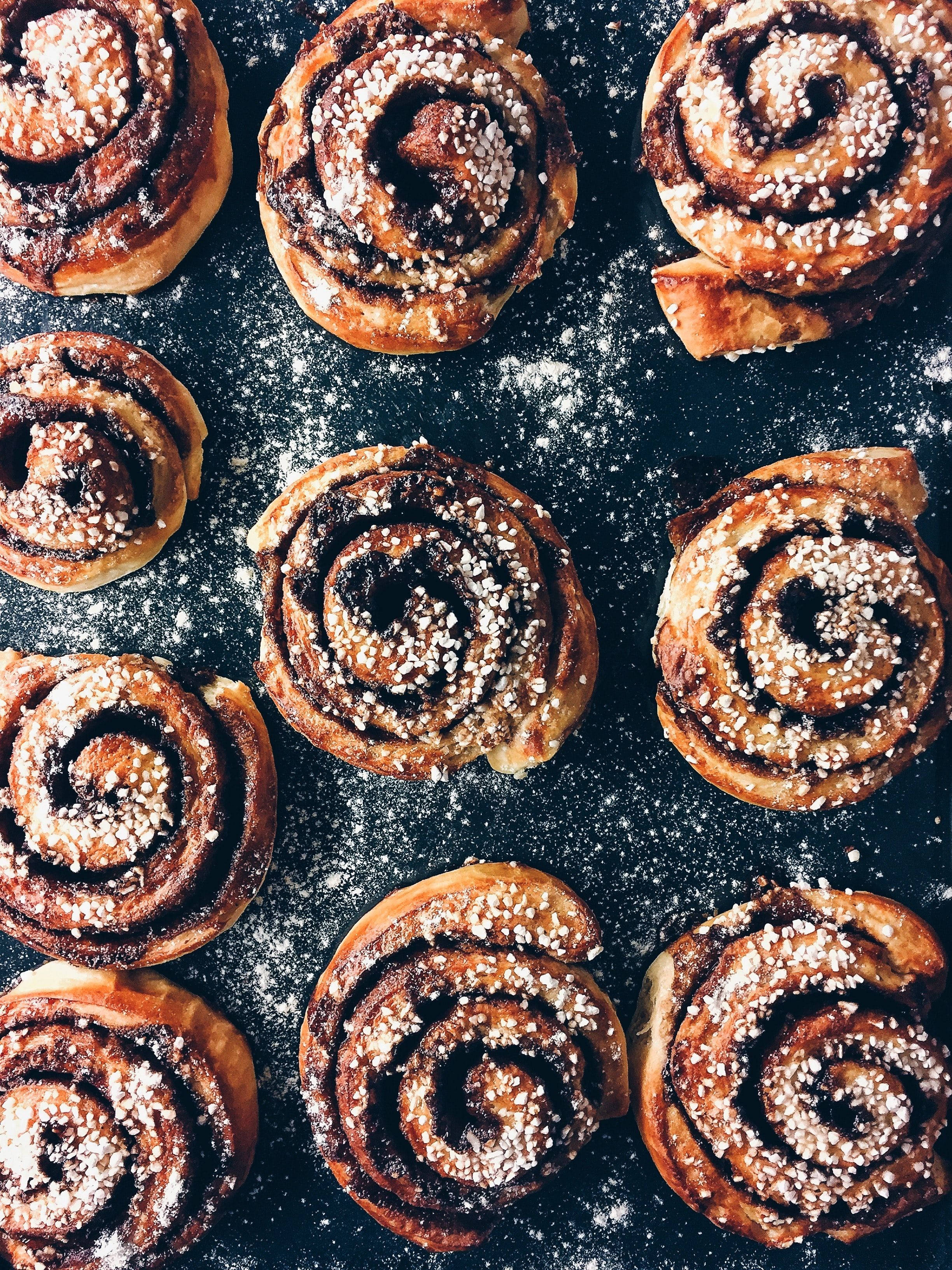 cinnamon rolls, sugar, dark floured surface, 2K Phone Wallpaper