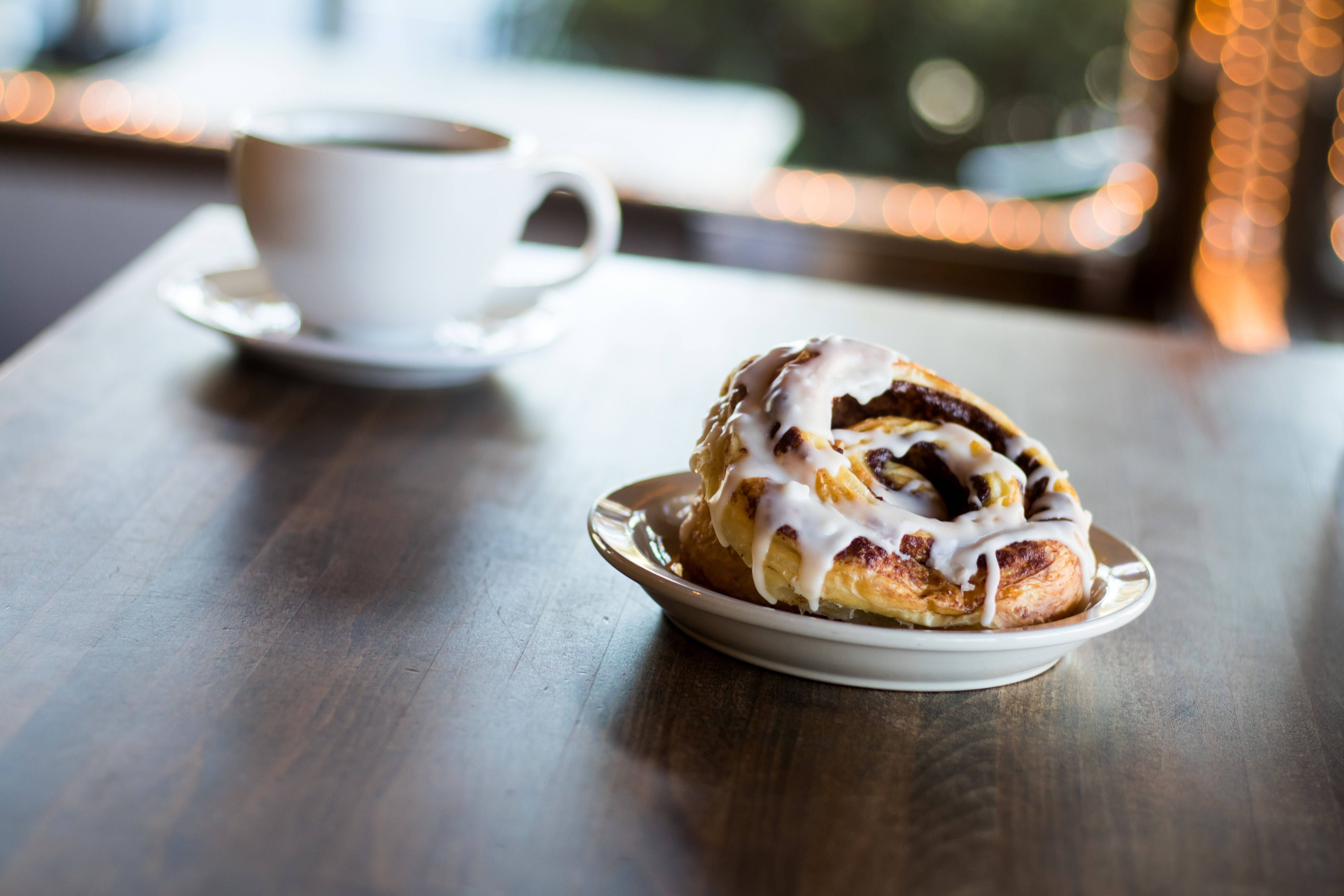 cinnamon roll, white icing, cup of coffee, 5K Desktop Wallpaper
