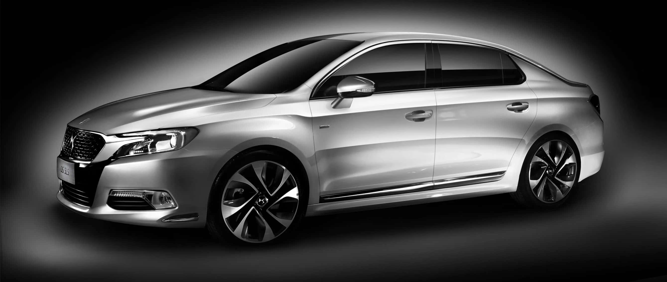 Citroen DS 5LS, sleek silver sedan, dramatic studio lighting, 2K Desktop Wallpaper