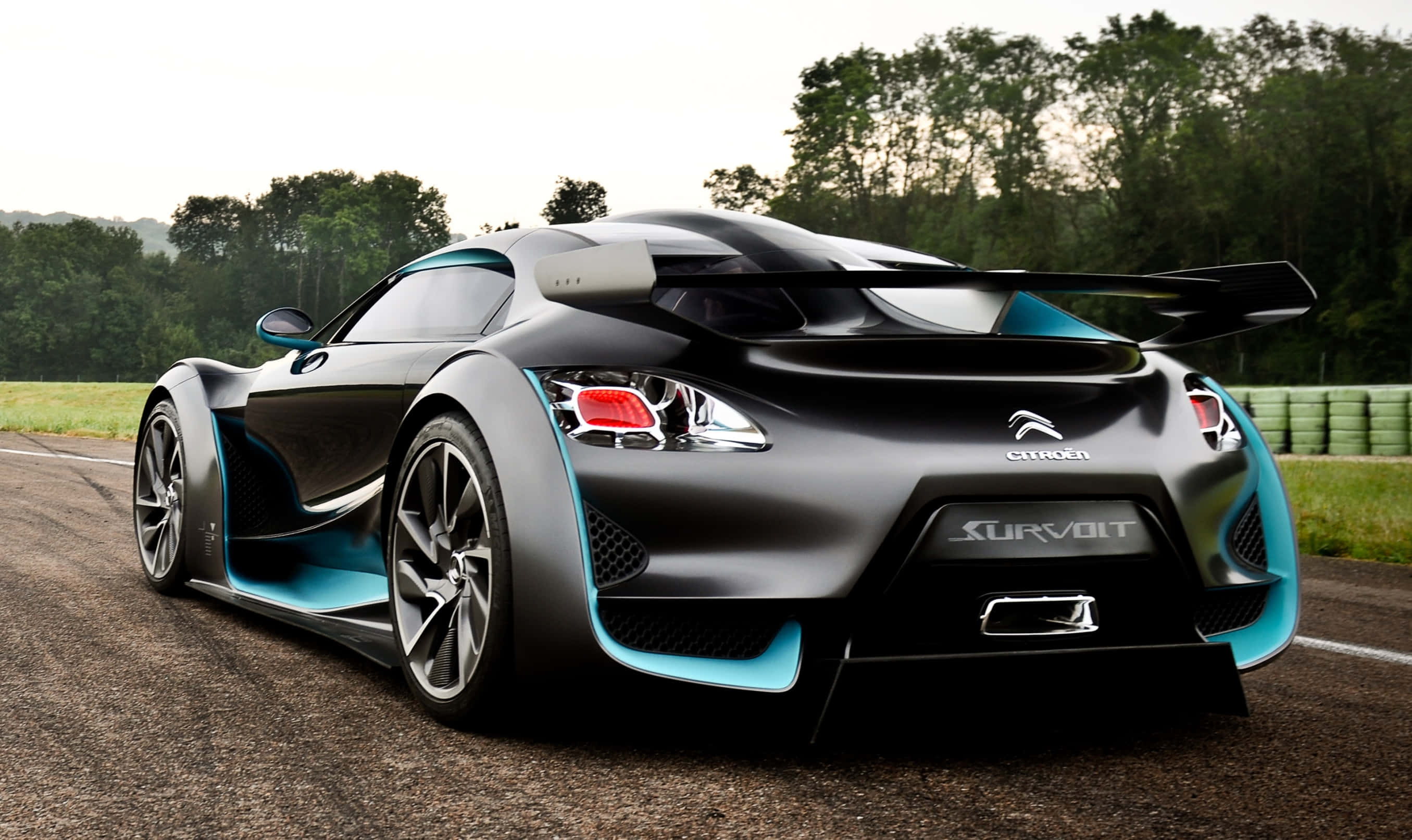 Citroen Ds Survolt, sleek black and turquoise, large rear wing, 2K Desktop Wallpaper