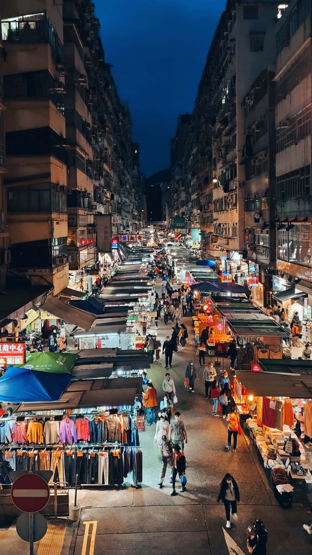 bustling night market, narrow urban alleyway, towering residential buildings, Full HD Phone Wallpaper