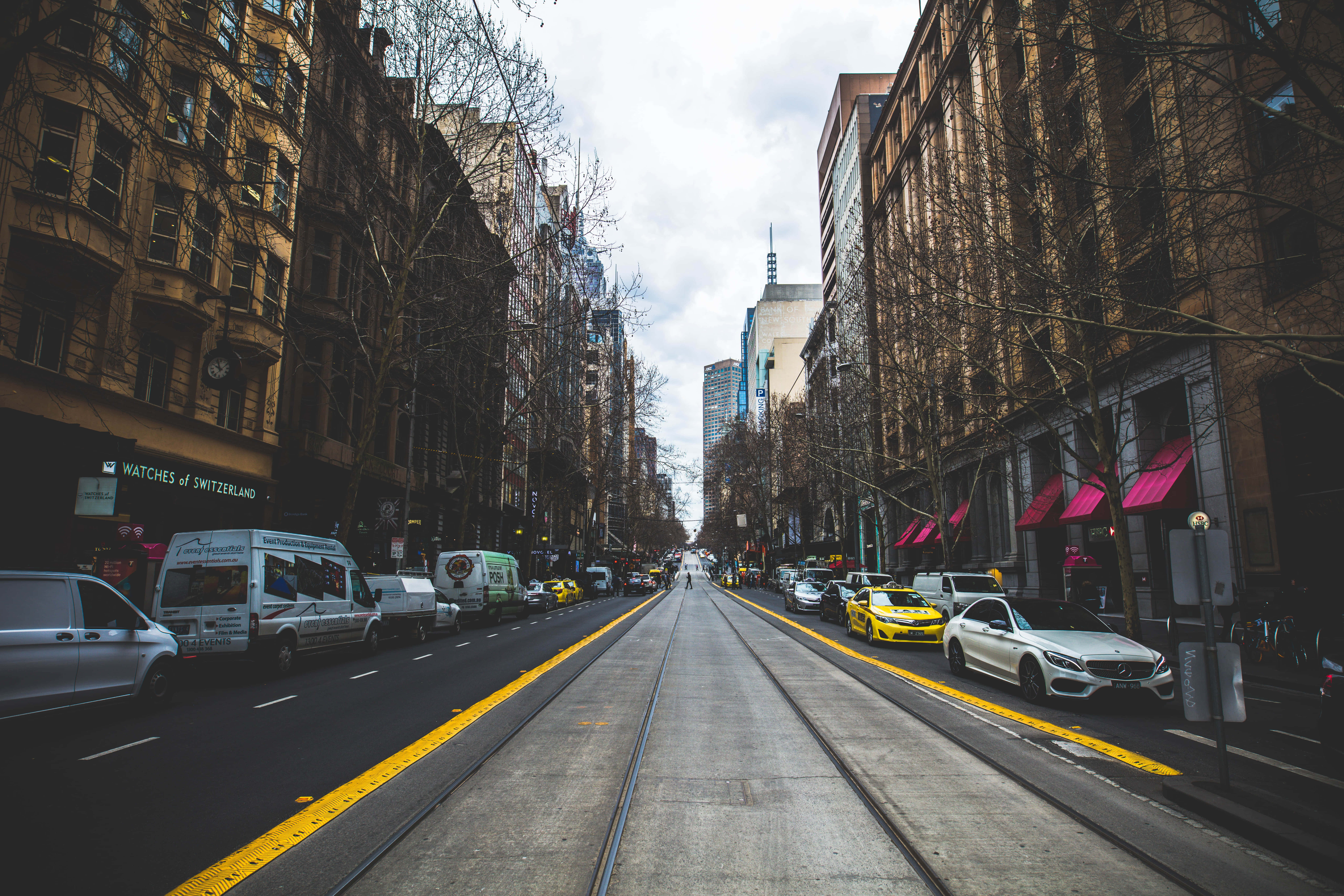 city street, historic brick buildings, modern skyscrapers, 8K Desktop Wallpaper