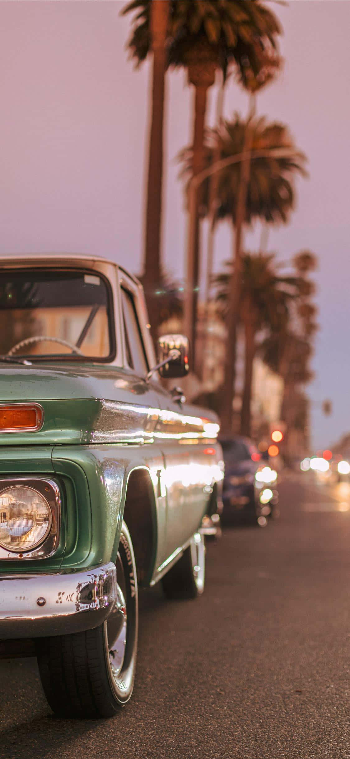 vintage green pickup truck, palm-lined street, twilight, Full HD Phone Wallpaper