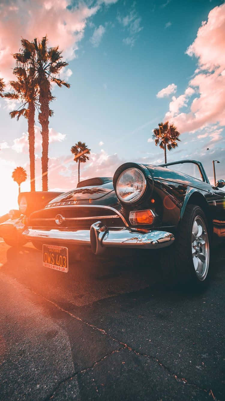 vintage black convertible sports car, warm sunset sky, palm trees, HD Phone Wallpaper