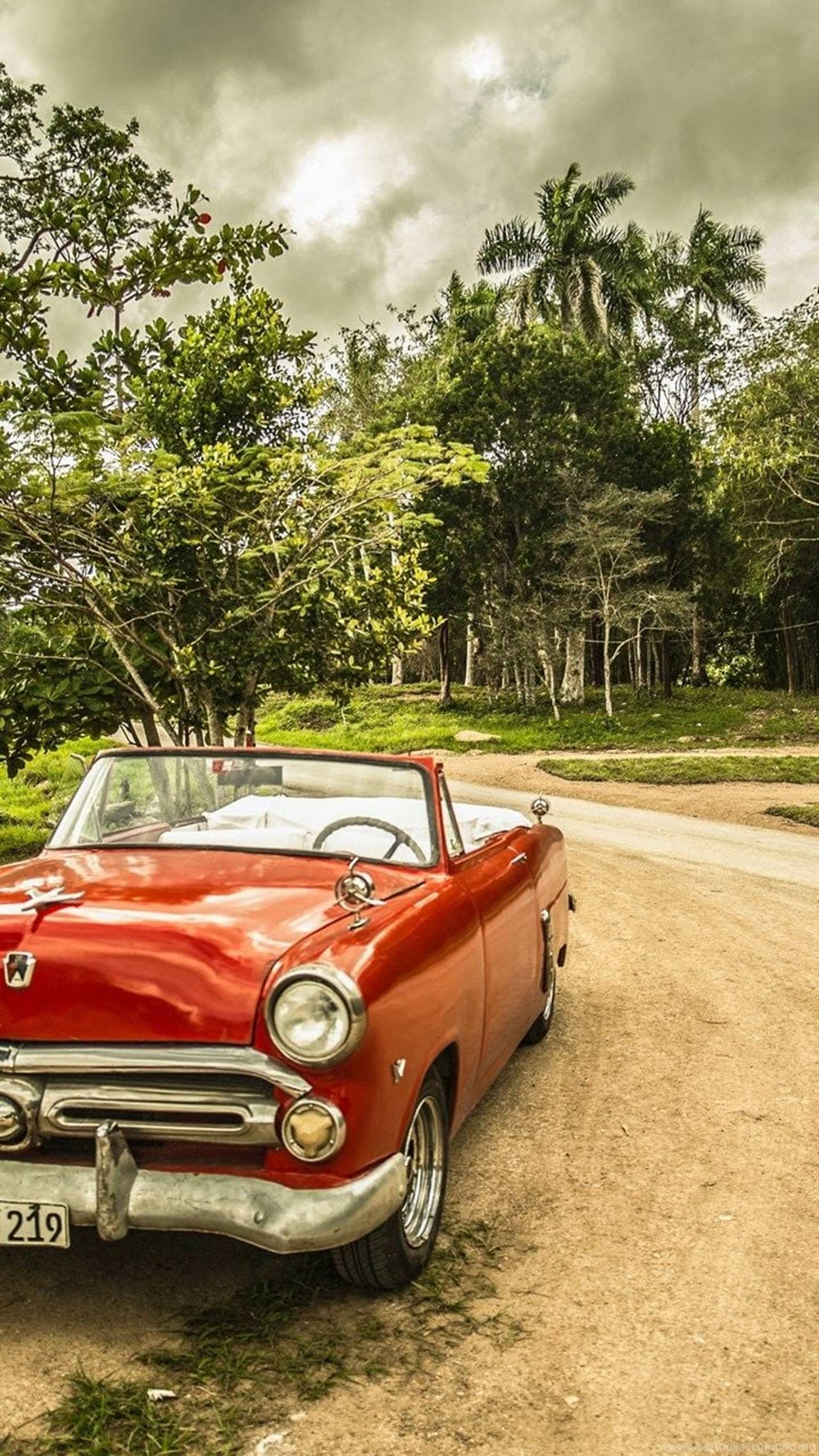 red classic convertible, dirt road, lush green trees, HD Phone Wallpaper