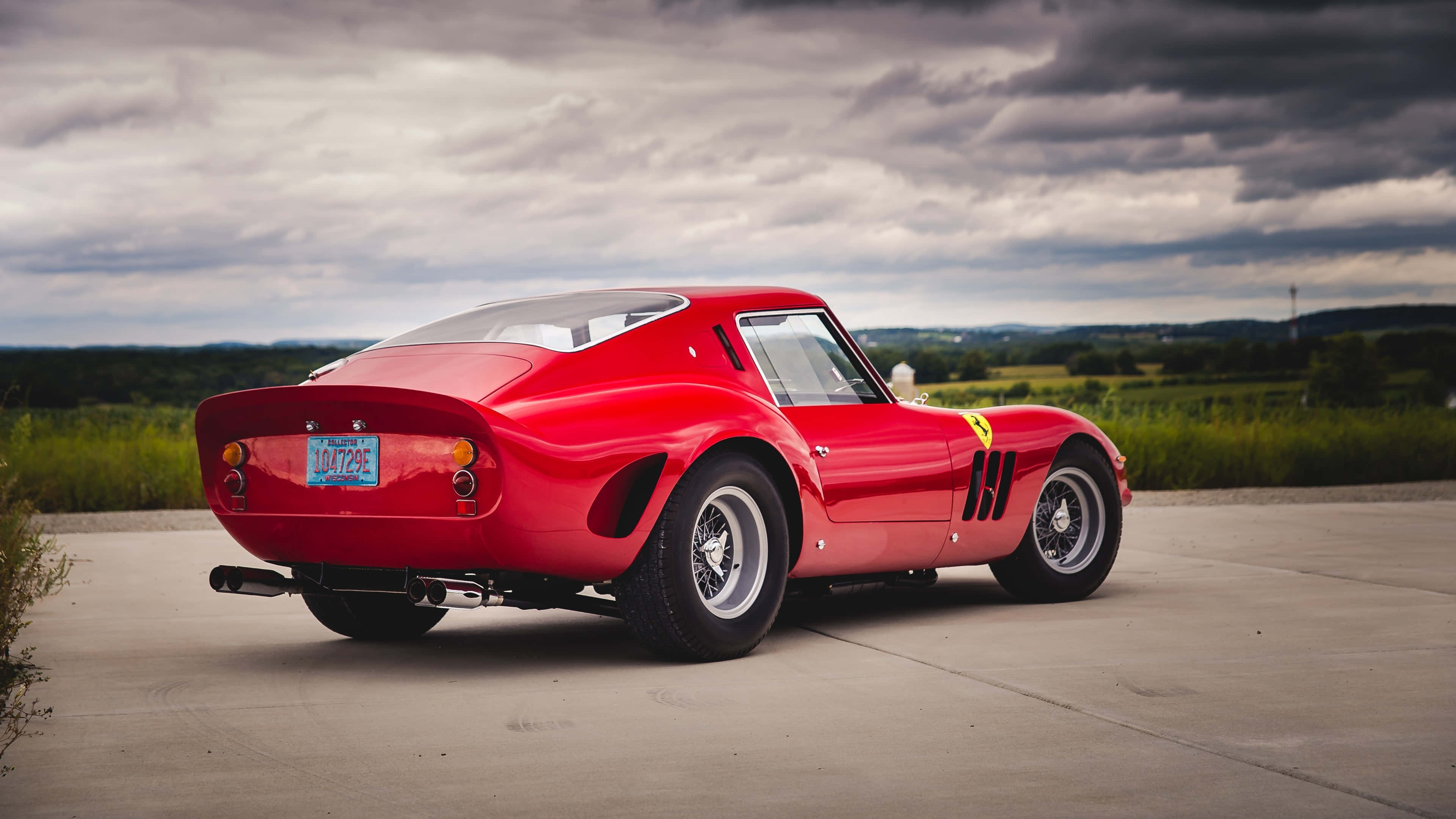 classic Ferrari, vibrant red, concrete pad, 4K Desktop Wallpaper