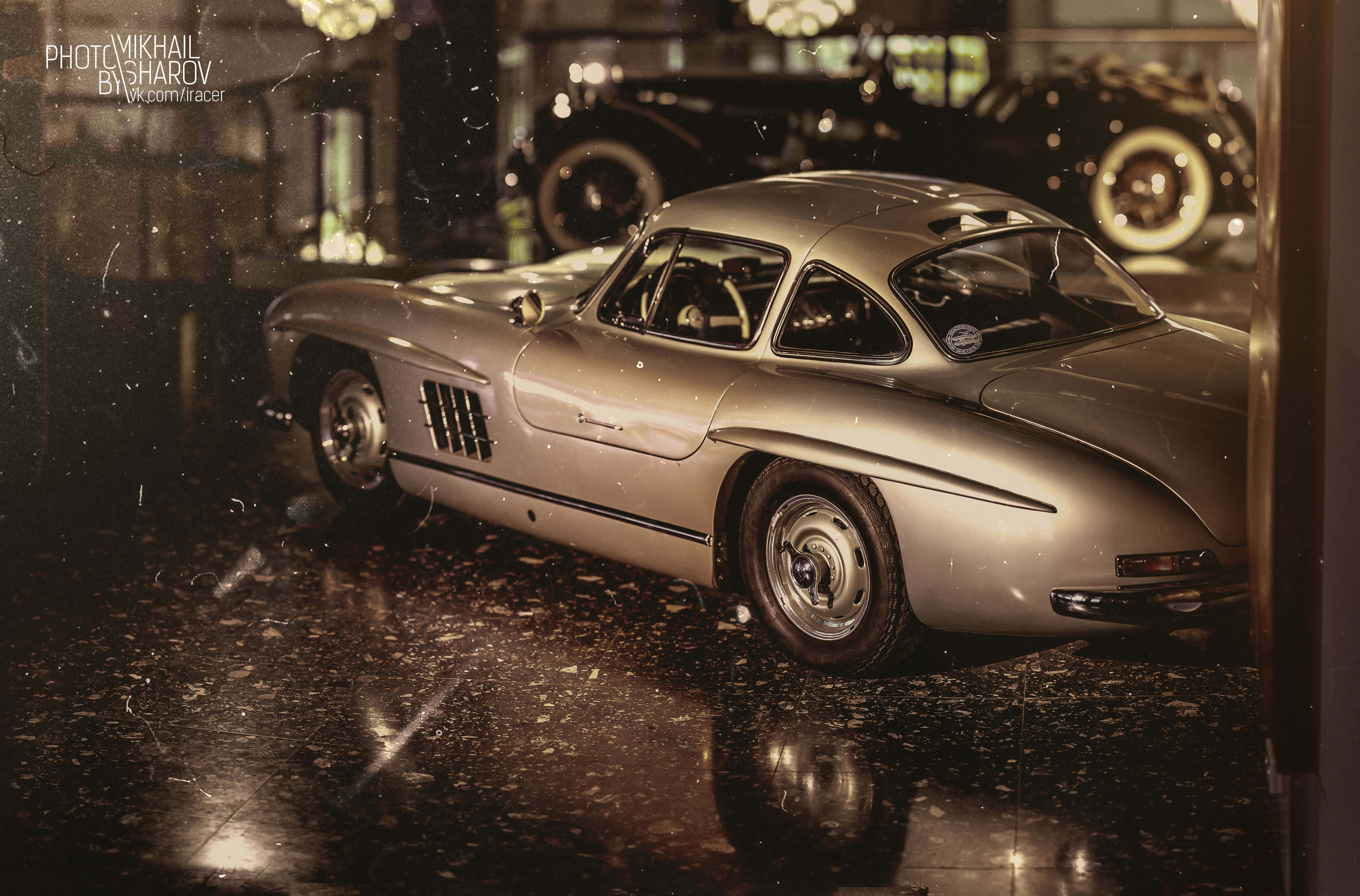 Classic Mercedes, vintage silver sports car, dimly lit classic car showroom, 5K Desktop Wallpaper