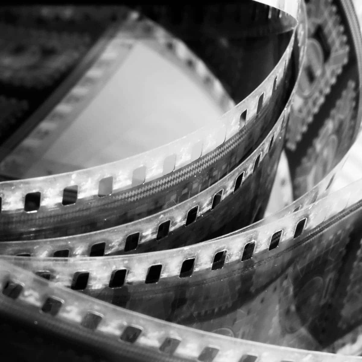 black and white film strips, perforations, close-up monochrome shot, SD Desktop Wallpaper