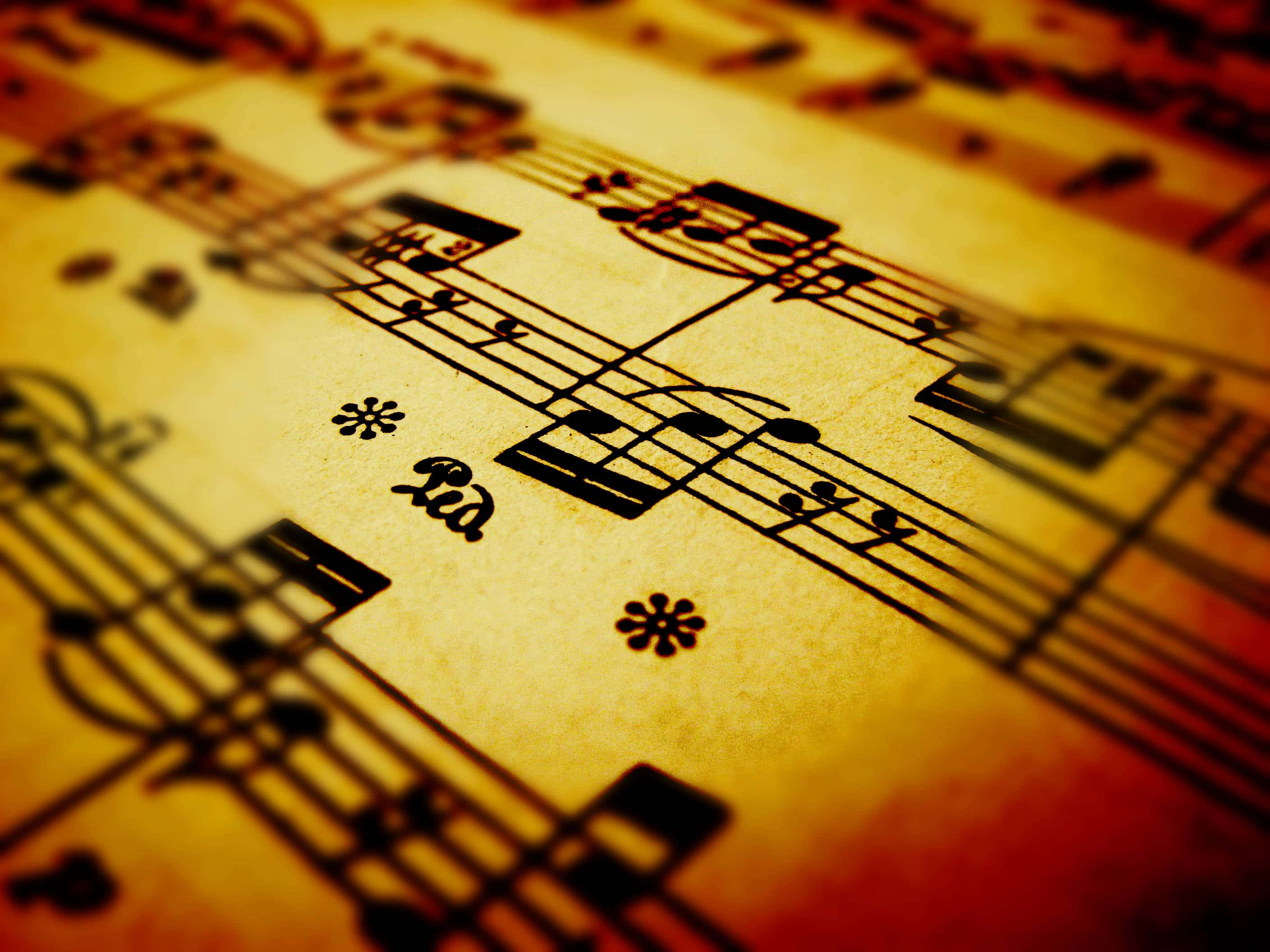 classical music, vintage sheet music, warm golden tones, 2K Desktop Wallpaper