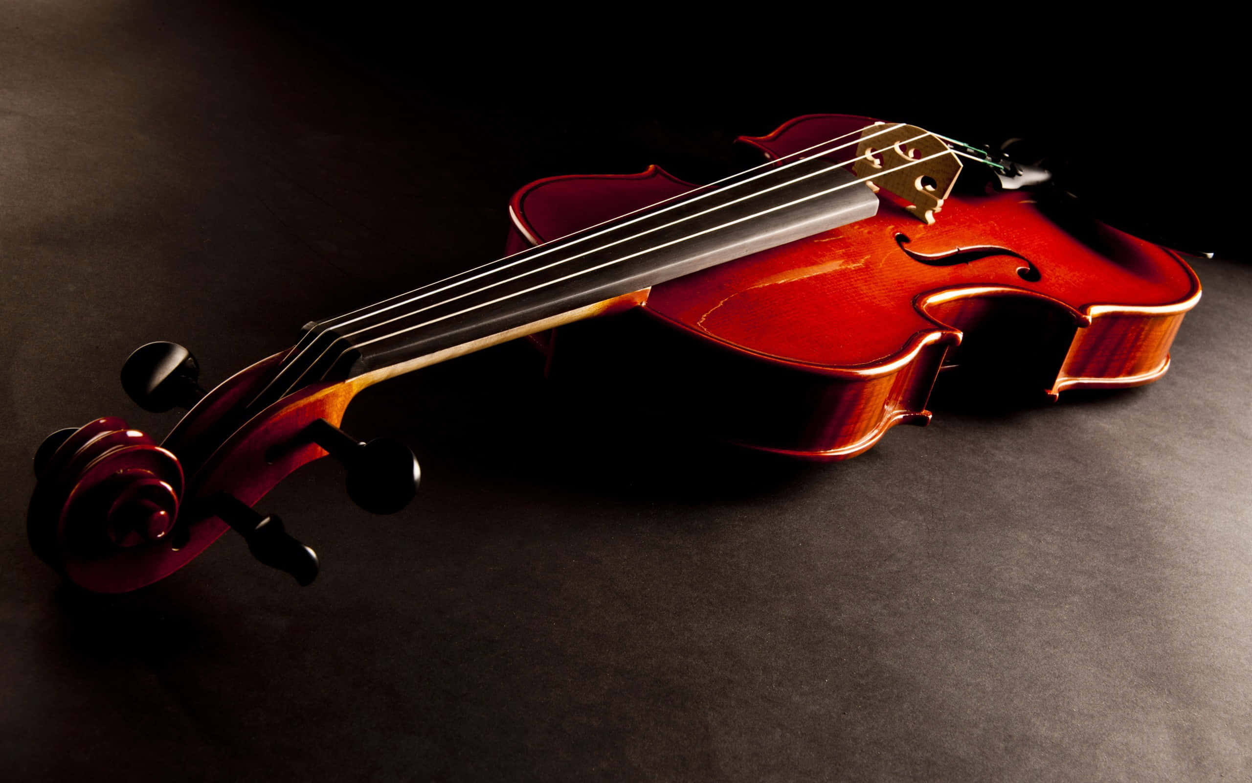 classical violin, dark textured surface, dramatic lighting, 2K Desktop Wallpaper