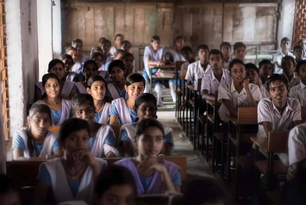 Indian students, white and blue uniforms, wooden desks, SD Desktop Wallpaper