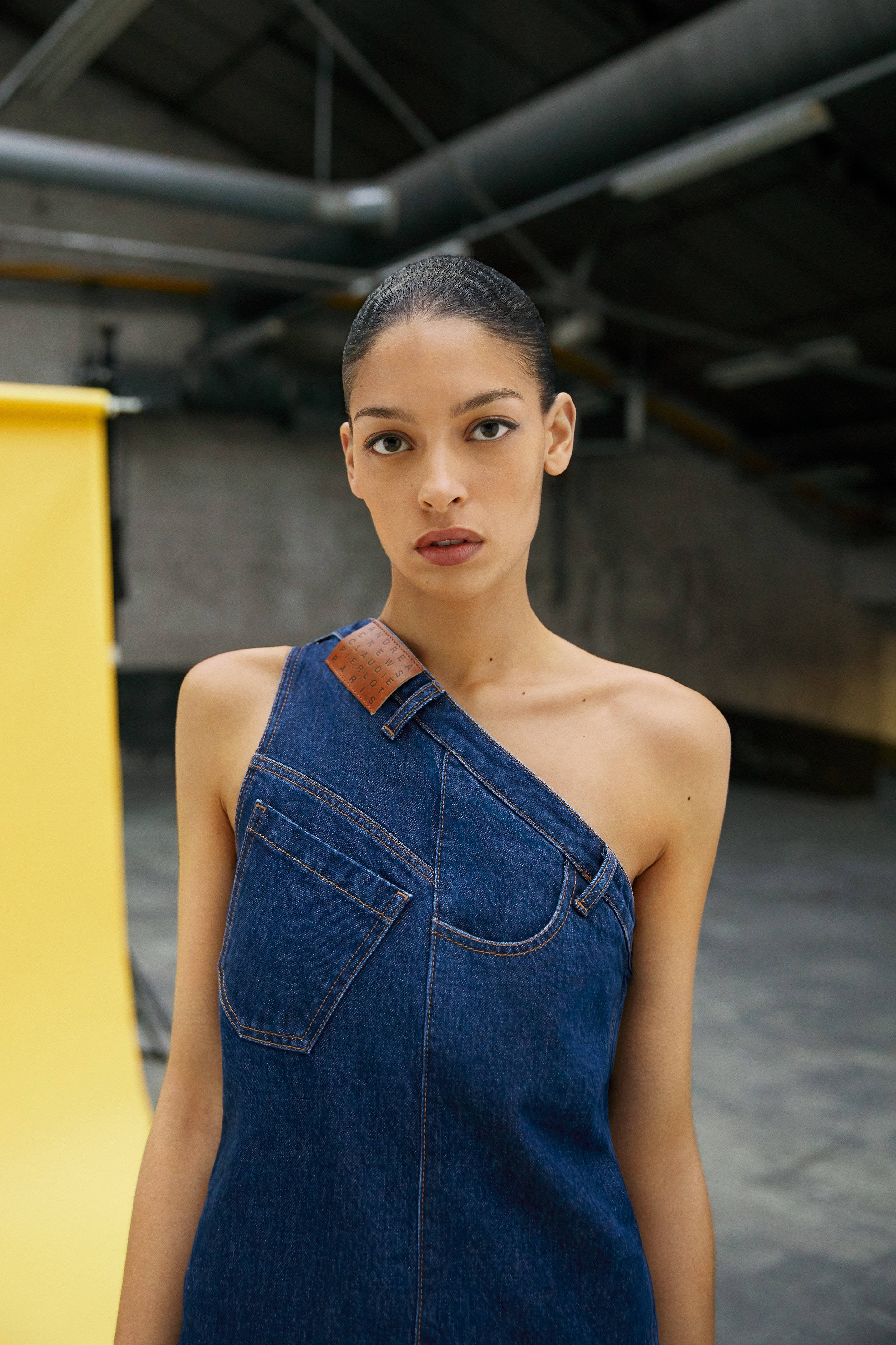 Claudie Pierlot, denim one-shoulder top, industrial warehouse, 4K Phone Wallpaper
