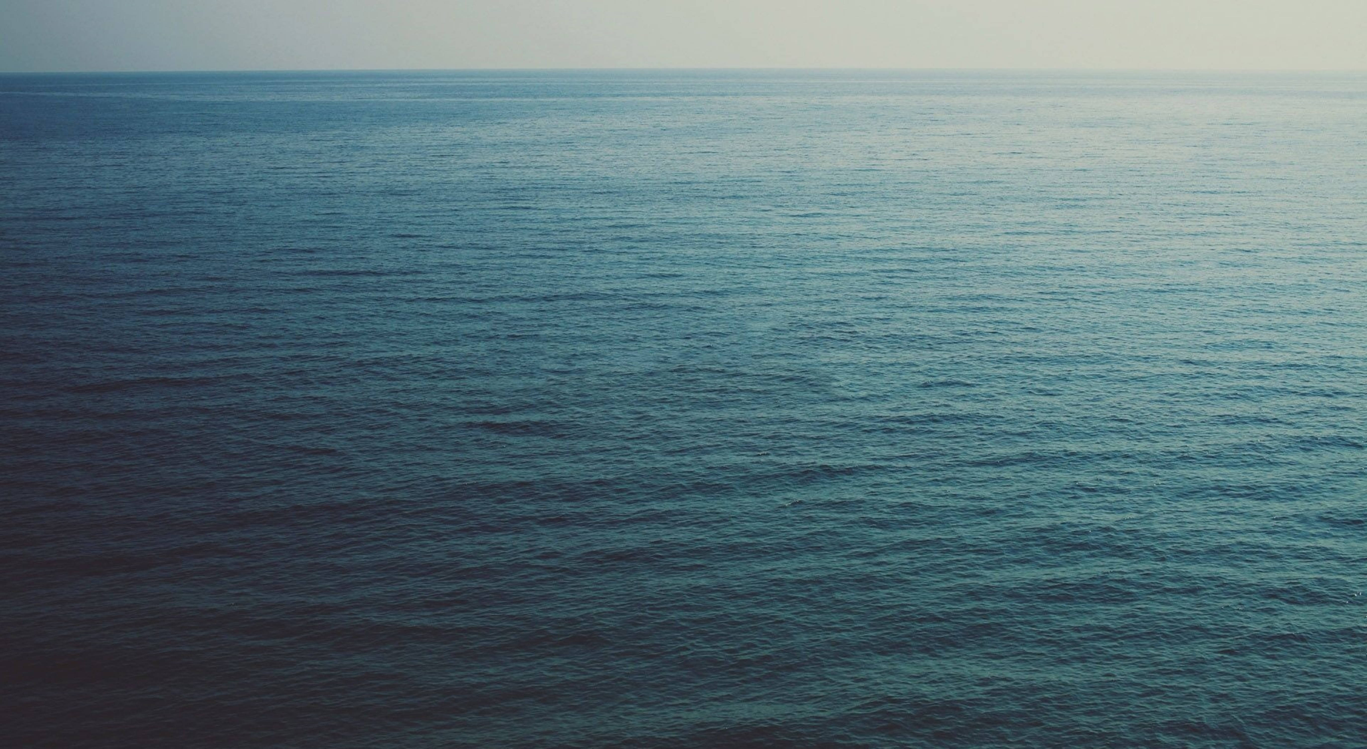 vast ocean, horizon, soft muted sky, 5K Desktop Wallpaper