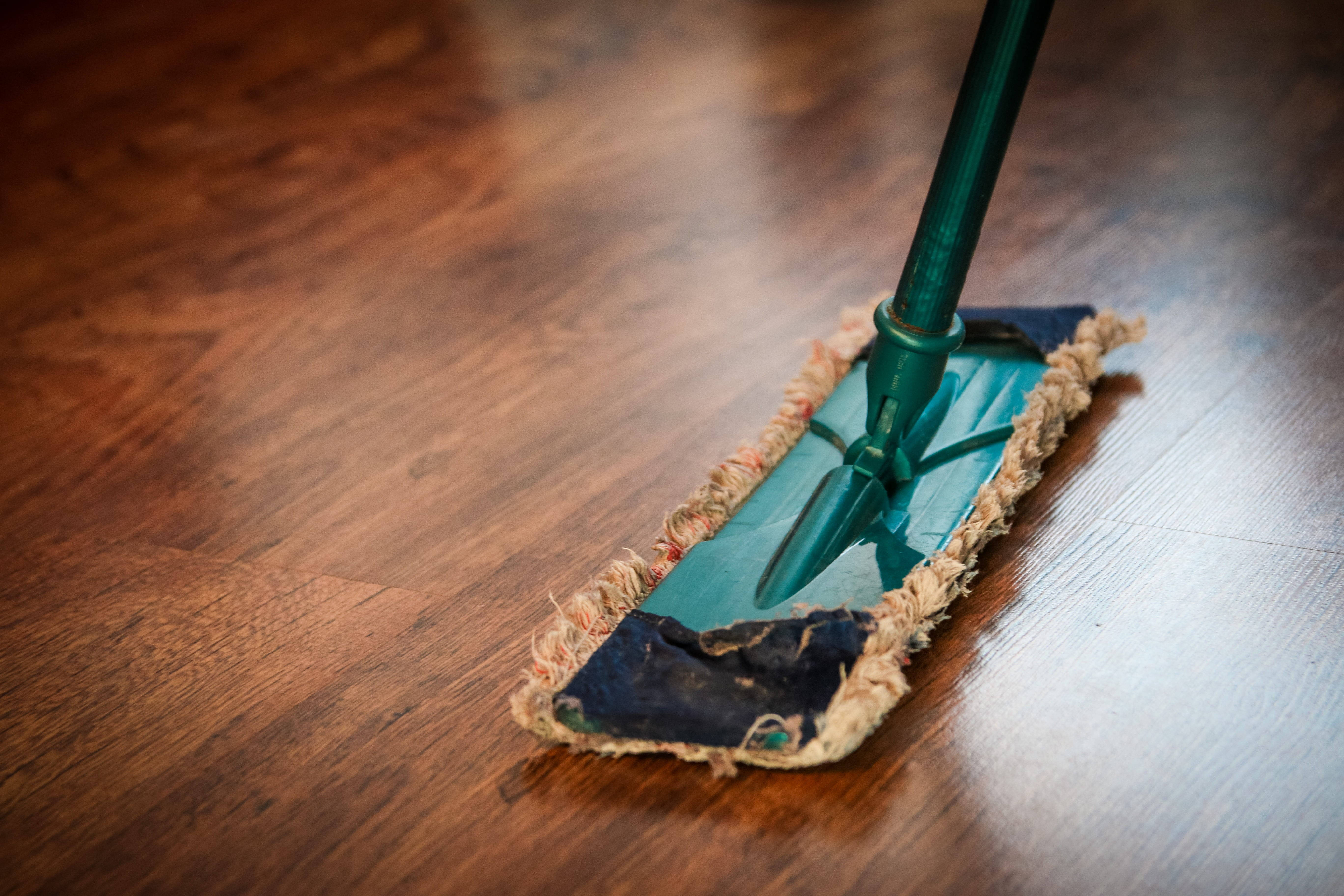 green mop head, polished hardwood floor, visible grain, 5K Desktop Wallpaper