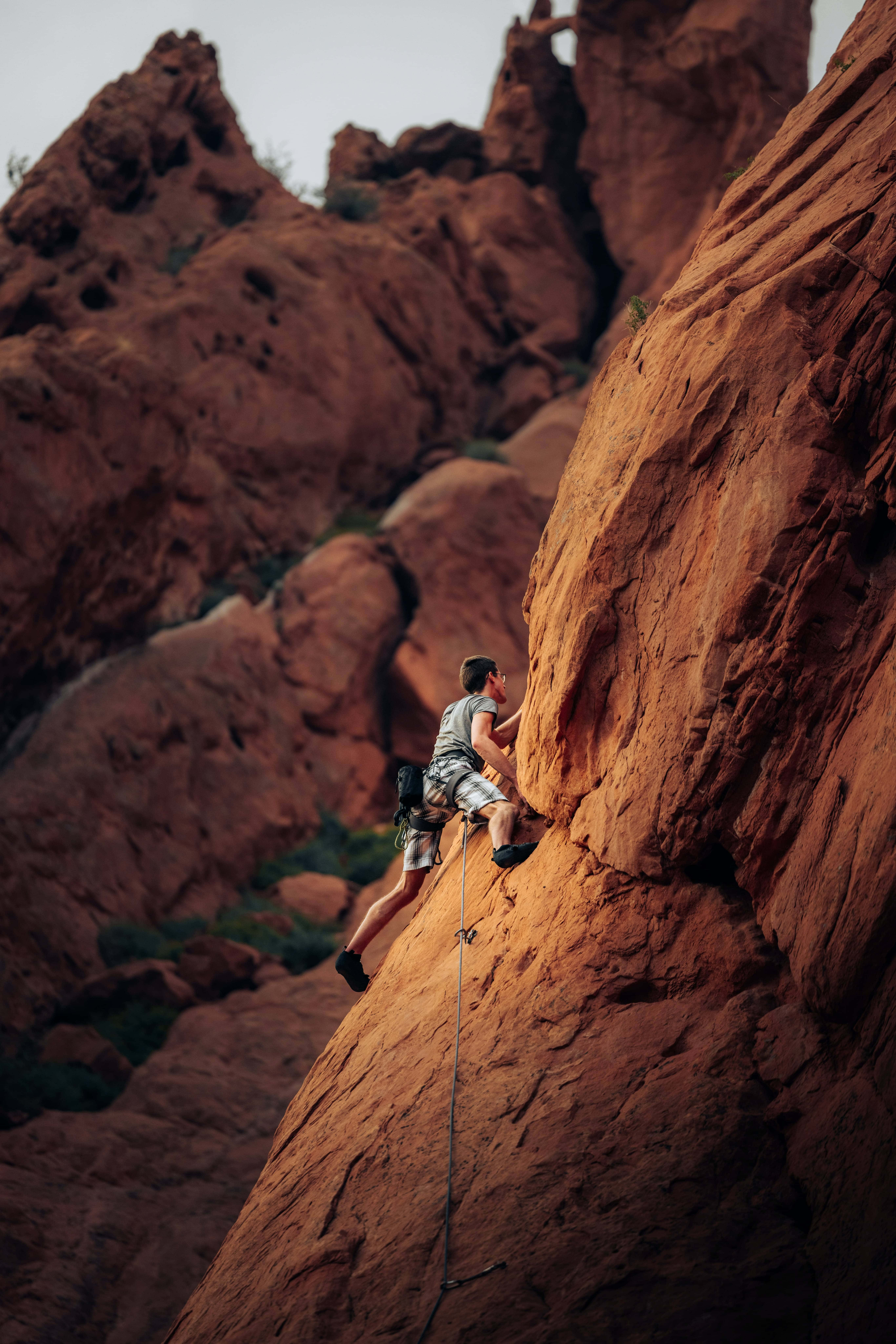 red rock face, rugged canyon backdrop, rope, 8K Phone Wallpaper