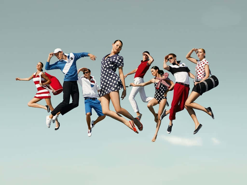 custom clothing design, eight stylishly dressed people, mid-air jump, SD Desktop Wallpaper