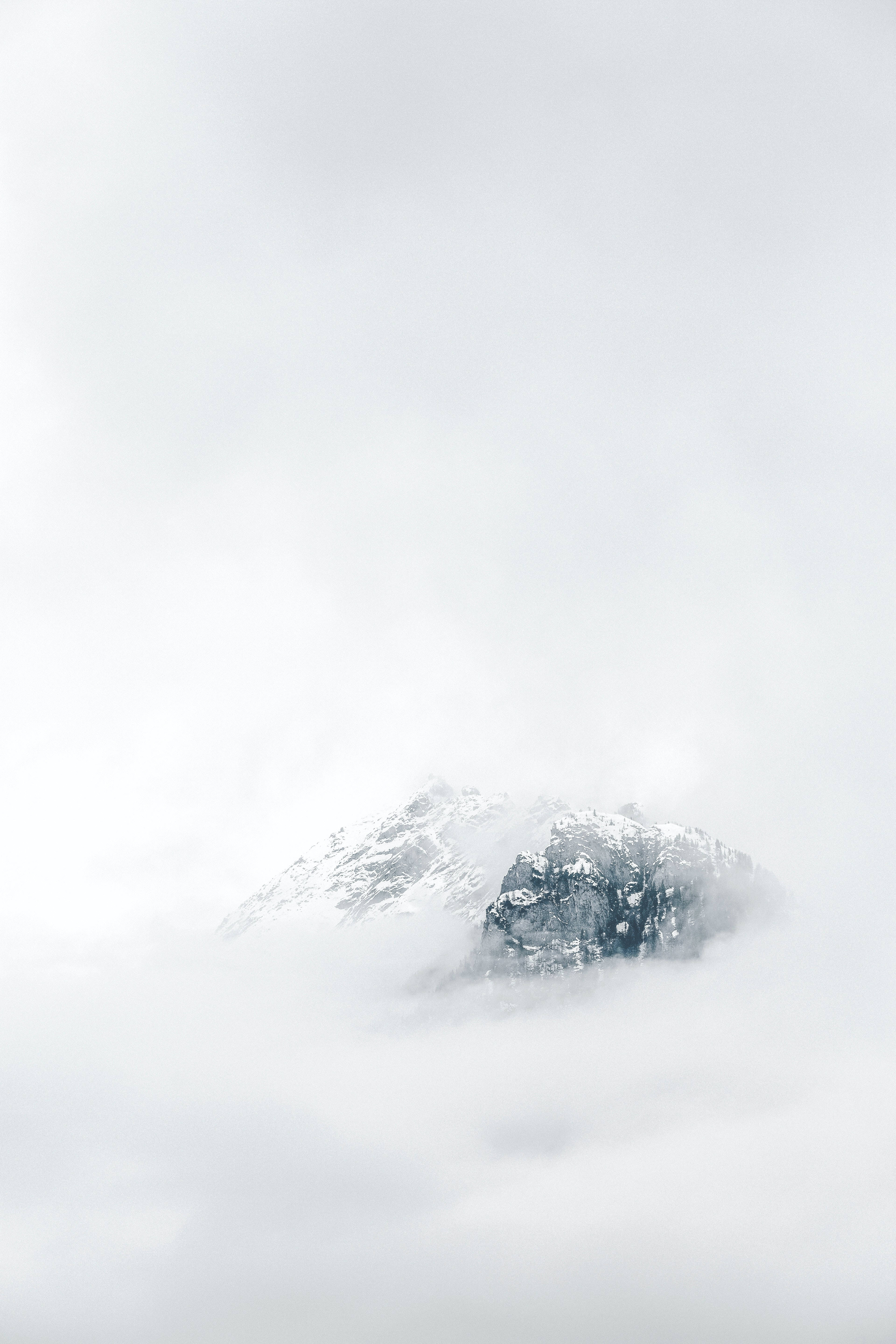 White Cloud iPhone, snowcapped mountain peak, thick blanket of clouds, 5K Phone Wallpaper