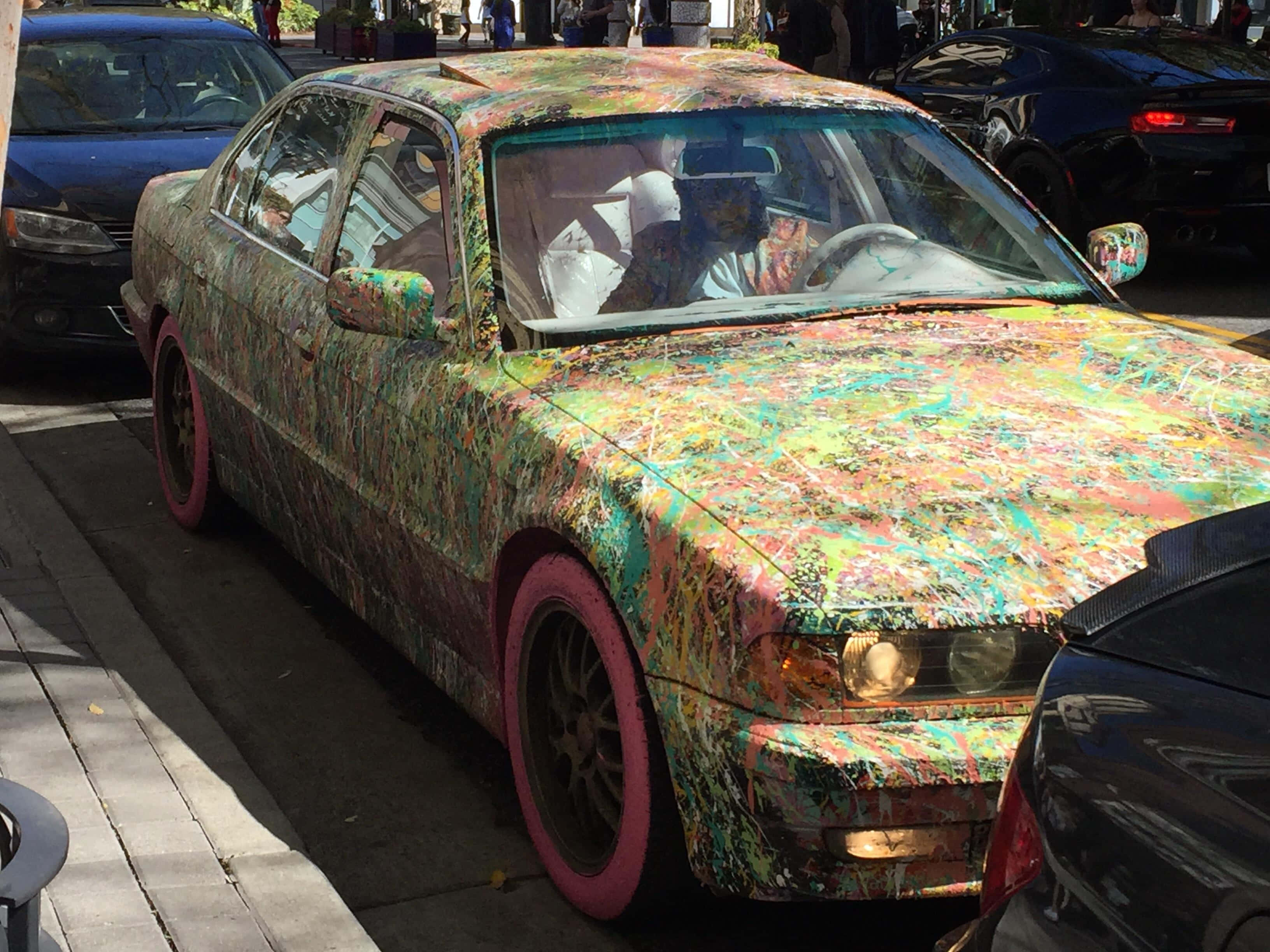 colorful paint splattered car, sedan, vibrant splattered paint, 2K Desktop Wallpaper