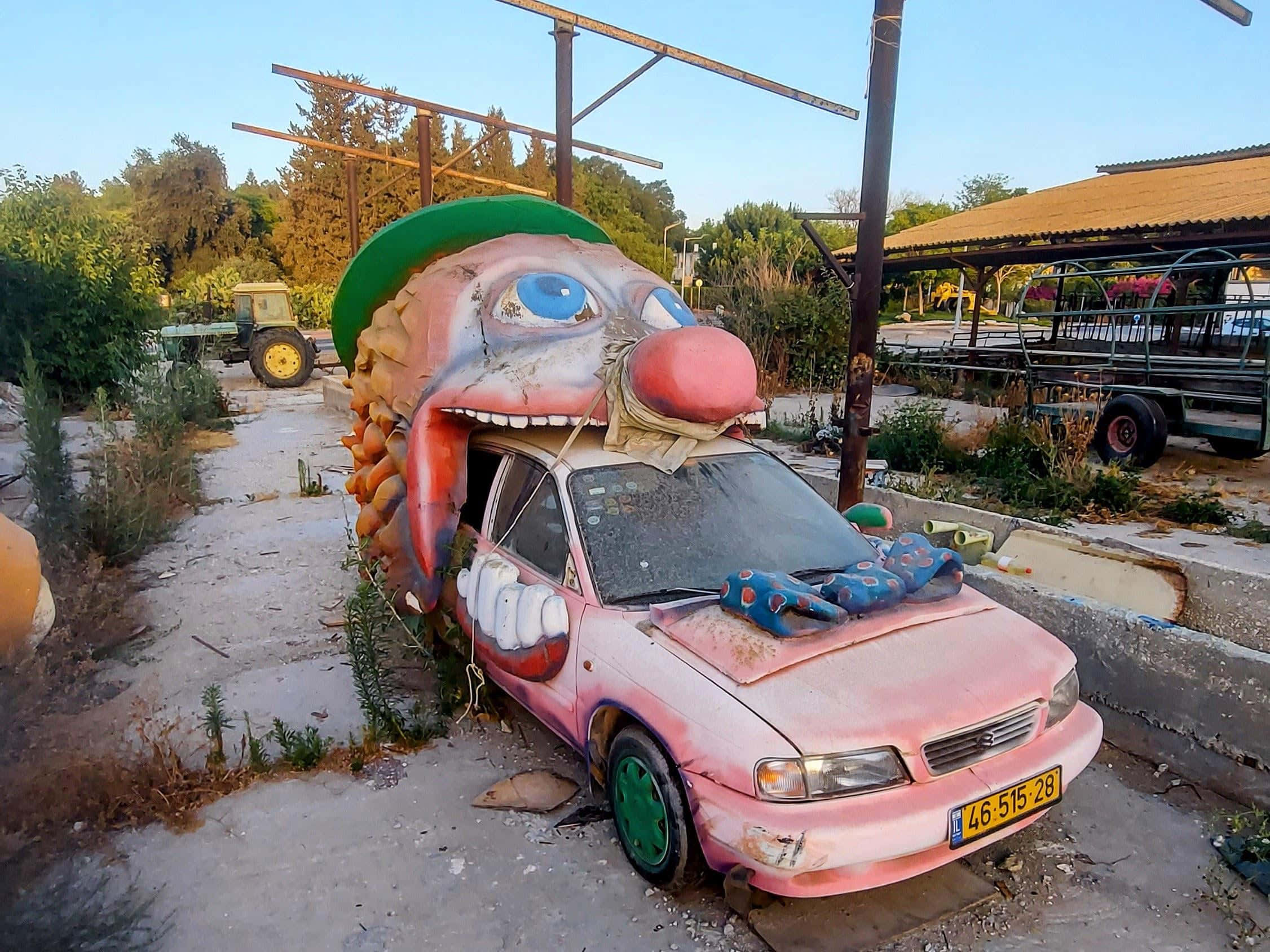 clown themed car art installation, pink car, giant clown head, Full HD Desktop Wallpaper