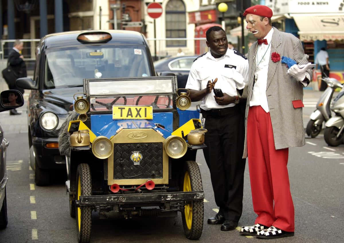 vintage blue and yellow taxi, gold accents, clown in red pants and a checkered coat, SD Desktop Wallpaper
