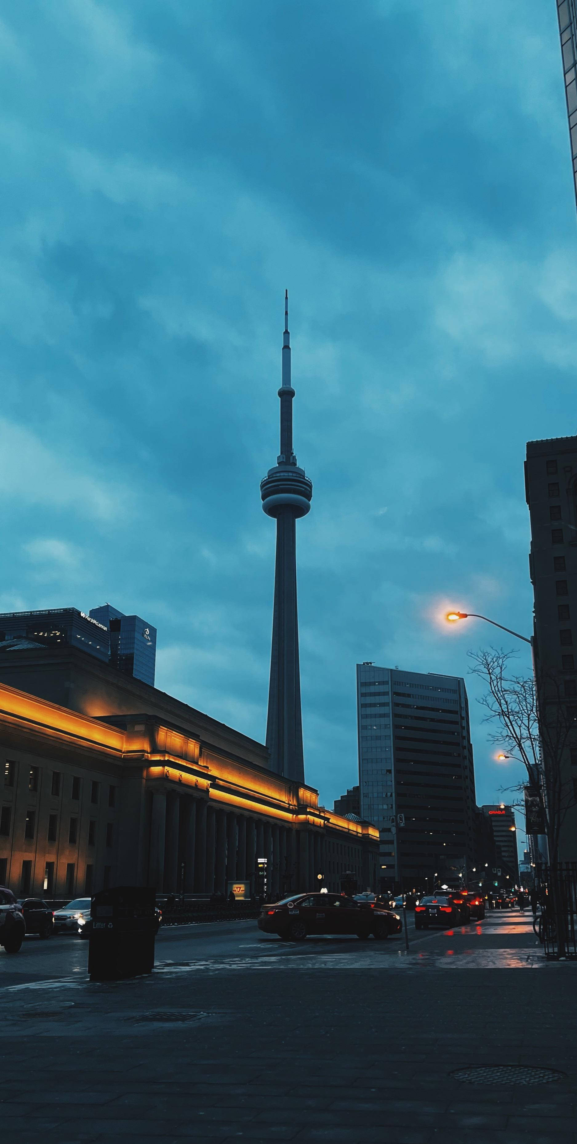 CN Tower, twilight cityscape, glowing streetlights, 2K Phone Wallpaper