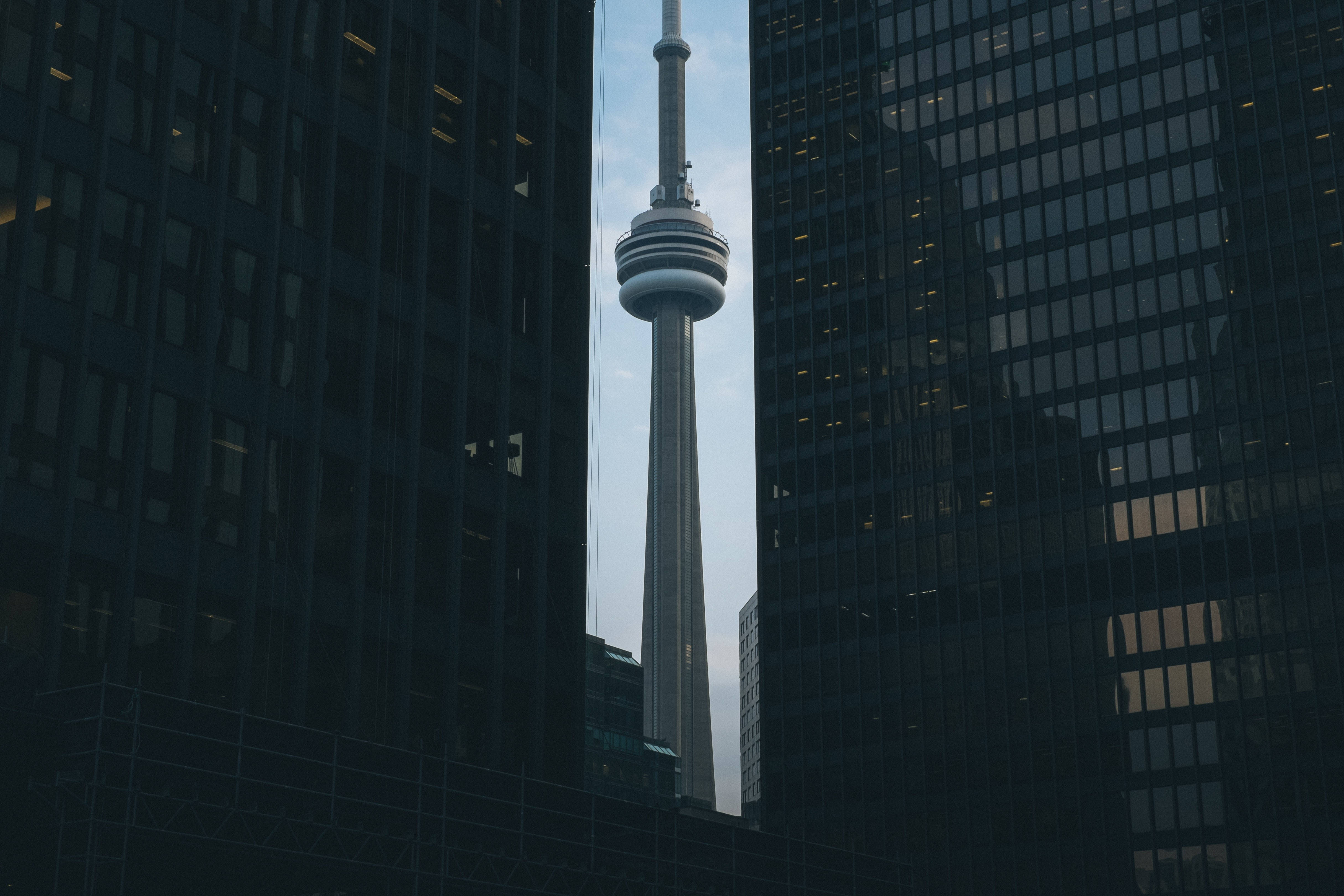 CN Tower, dark glass skyscrapers, pale sky, 4K Desktop Wallpaper