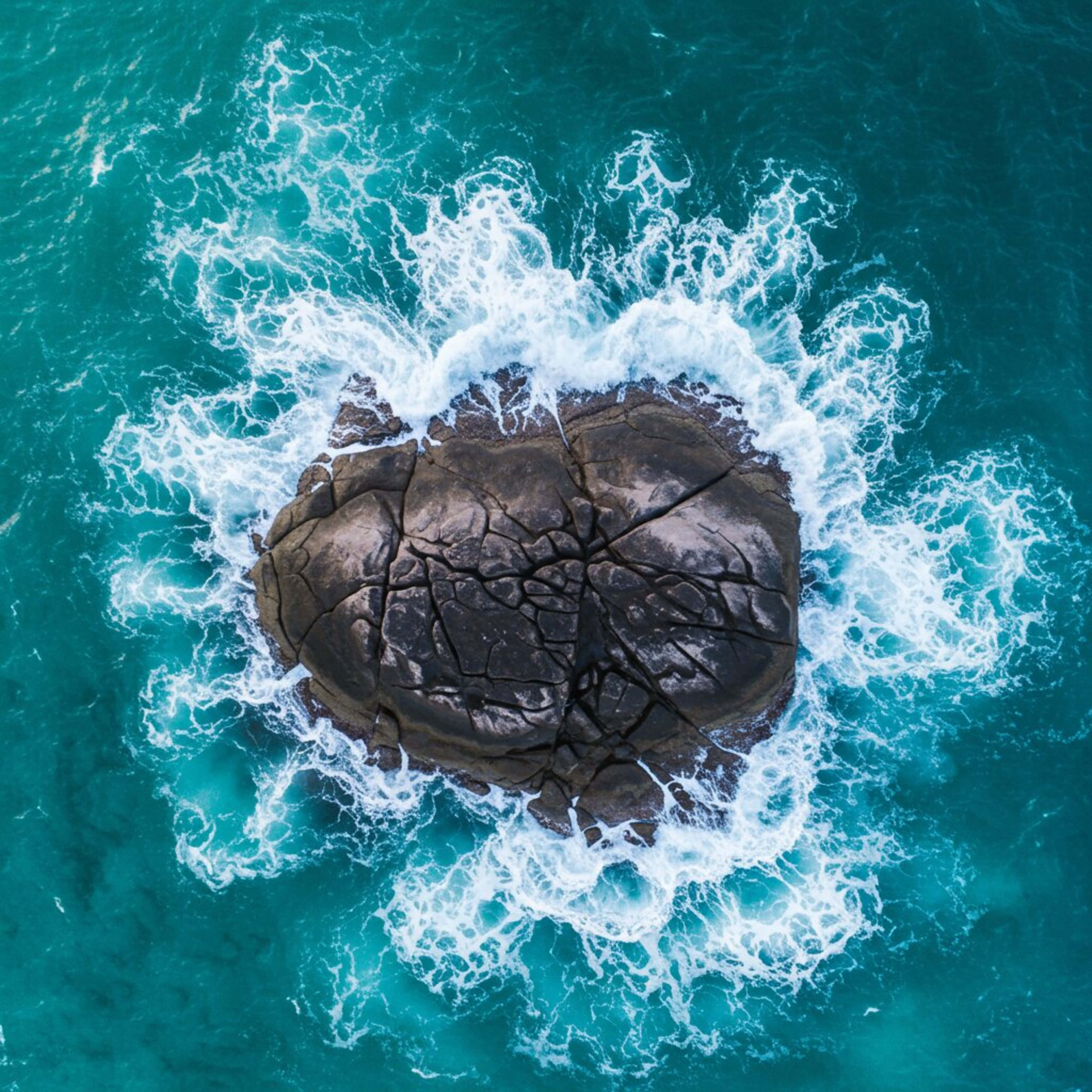 island on the sea, dark cracked rock, turquoise ocean waves, 4K Desktop Wallpaper