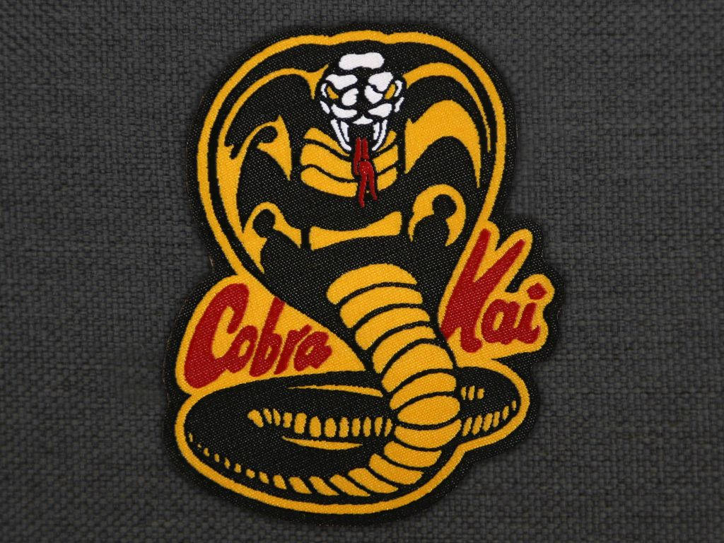 Cobra Kai, yellow and black cobra, dark gray fabric, SD Desktop Wallpaper