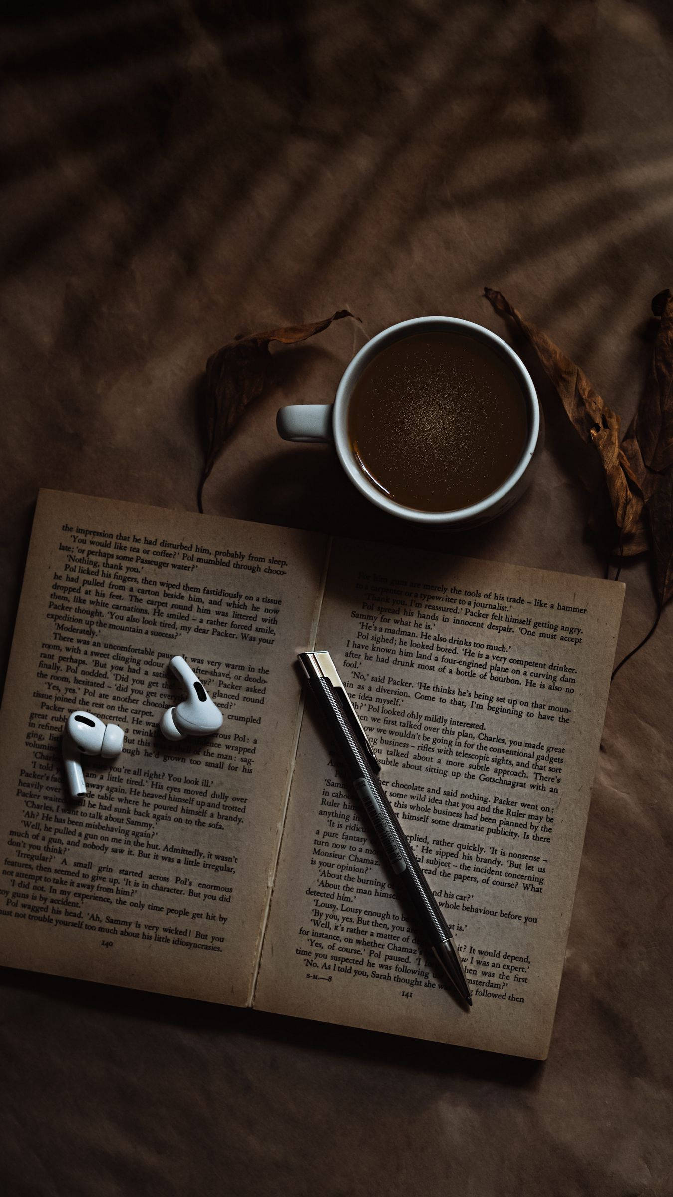 silver coffee mug, white earbuds, open book, Full HD Phone Wallpaper