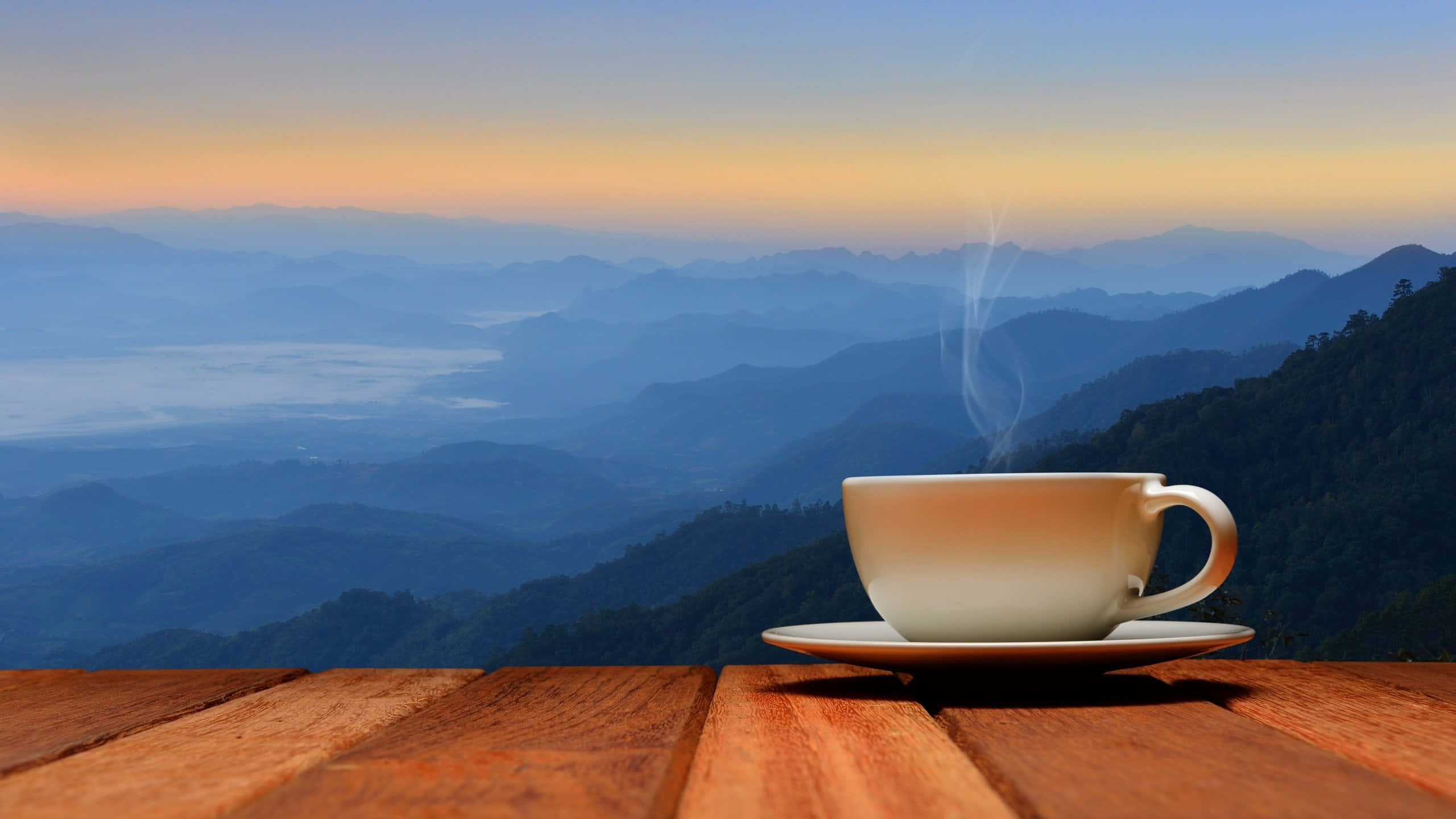 coffee cup, wooden table, misty mountain ranges, 2K Desktop Wallpaper