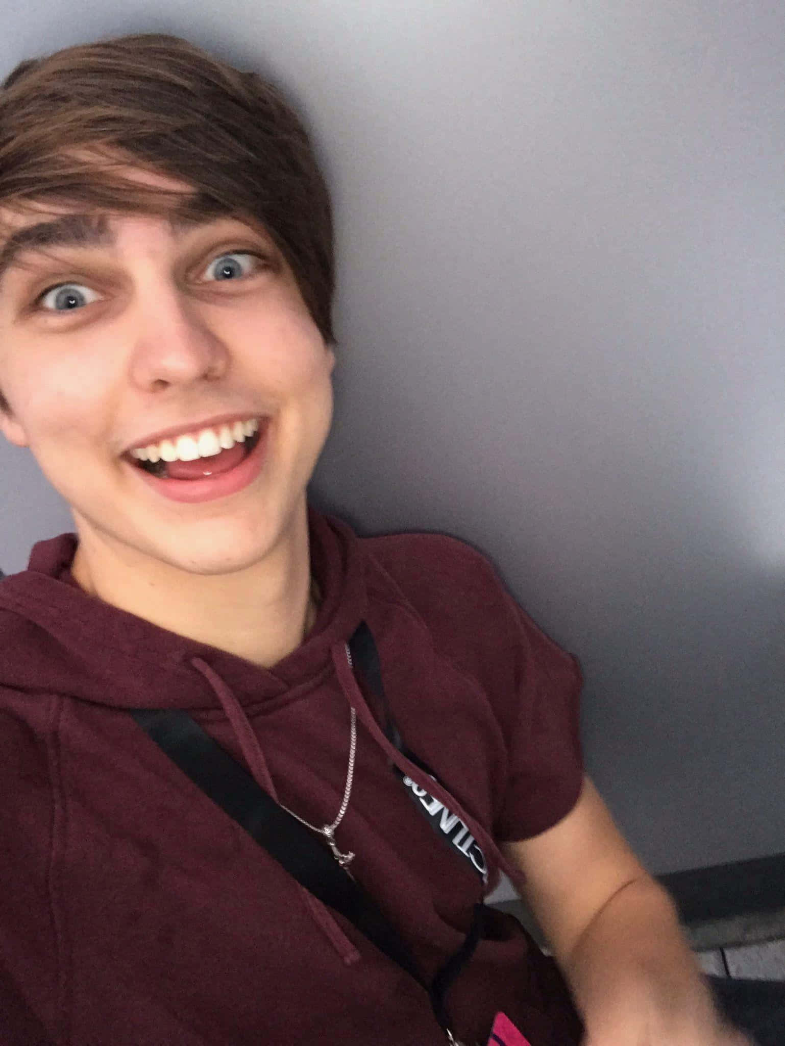 Colby Brock, maroon hoodie, plain gray wall, Full HD Phone Wallpaper