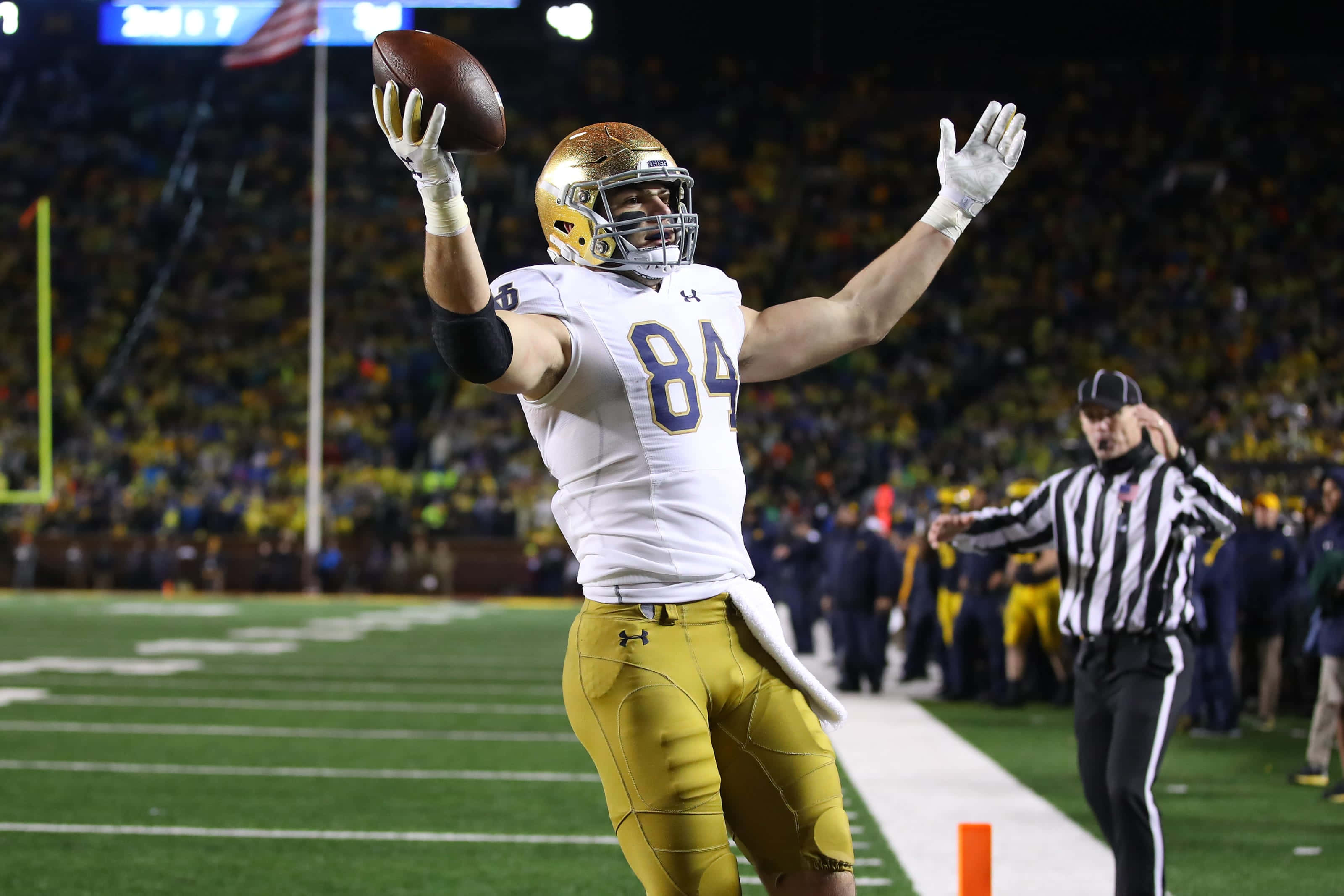 Cole Kmet, white and gold uniform, lit field at night, 2K Desktop Wallpaper