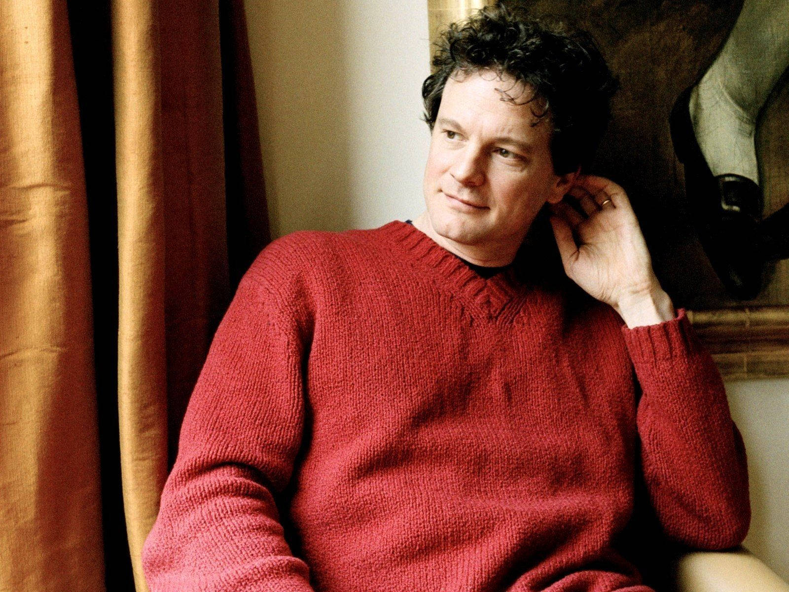 Colin Firth, red knit sweater, warmly lit room, HD Desktop Wallpaper