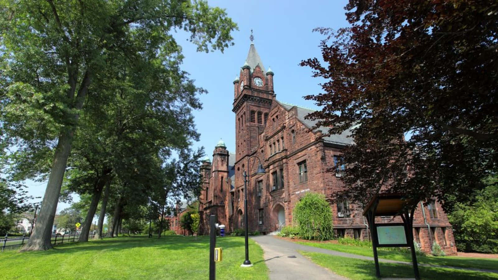red brick clock tower building, clear blue sky, lush green and burgundy trees, HD Desktop Wallpaper